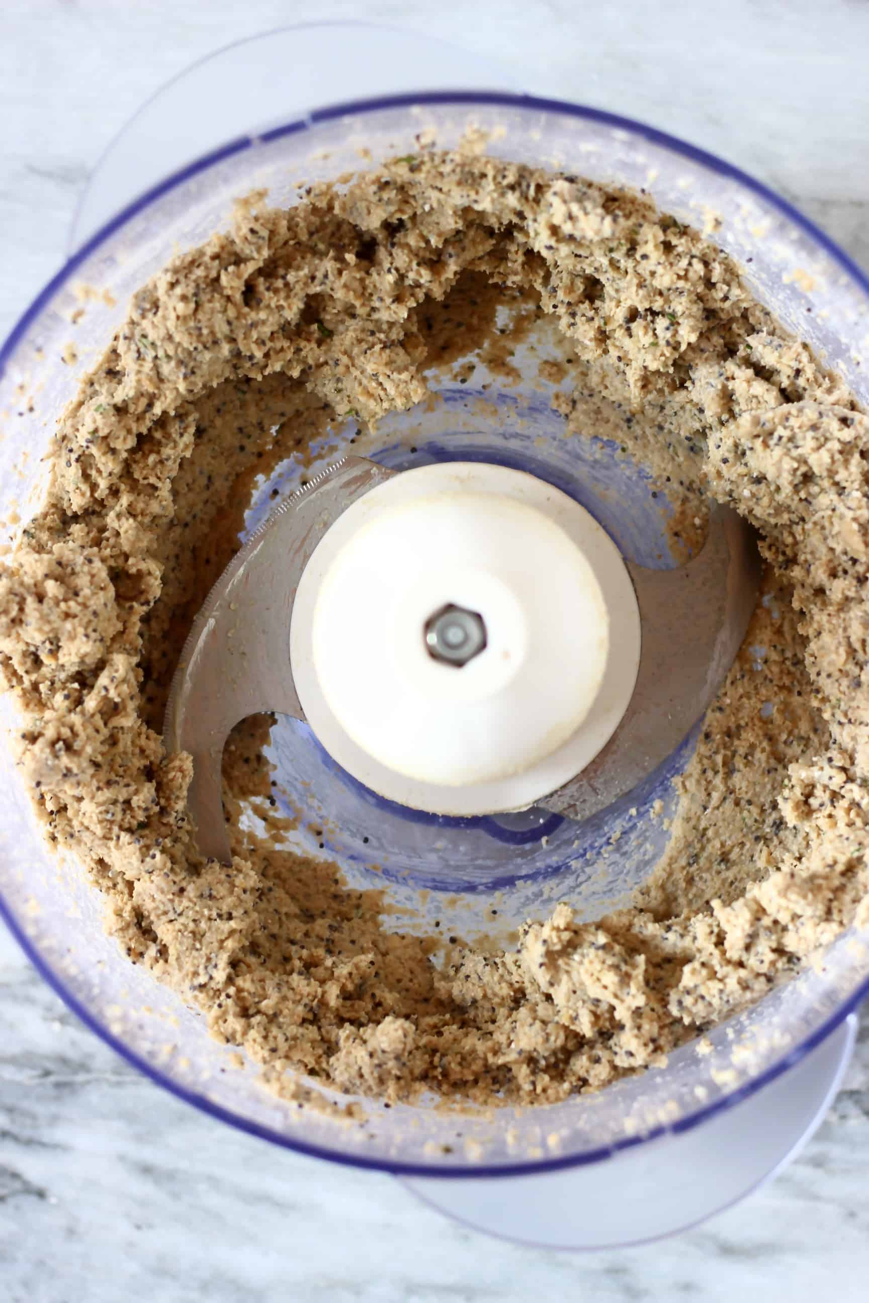 Raw gluten-free vegan crackers mixture in a food processor