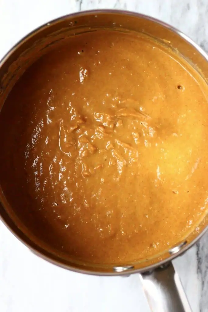 Pumpkin pie filling in a silver pan