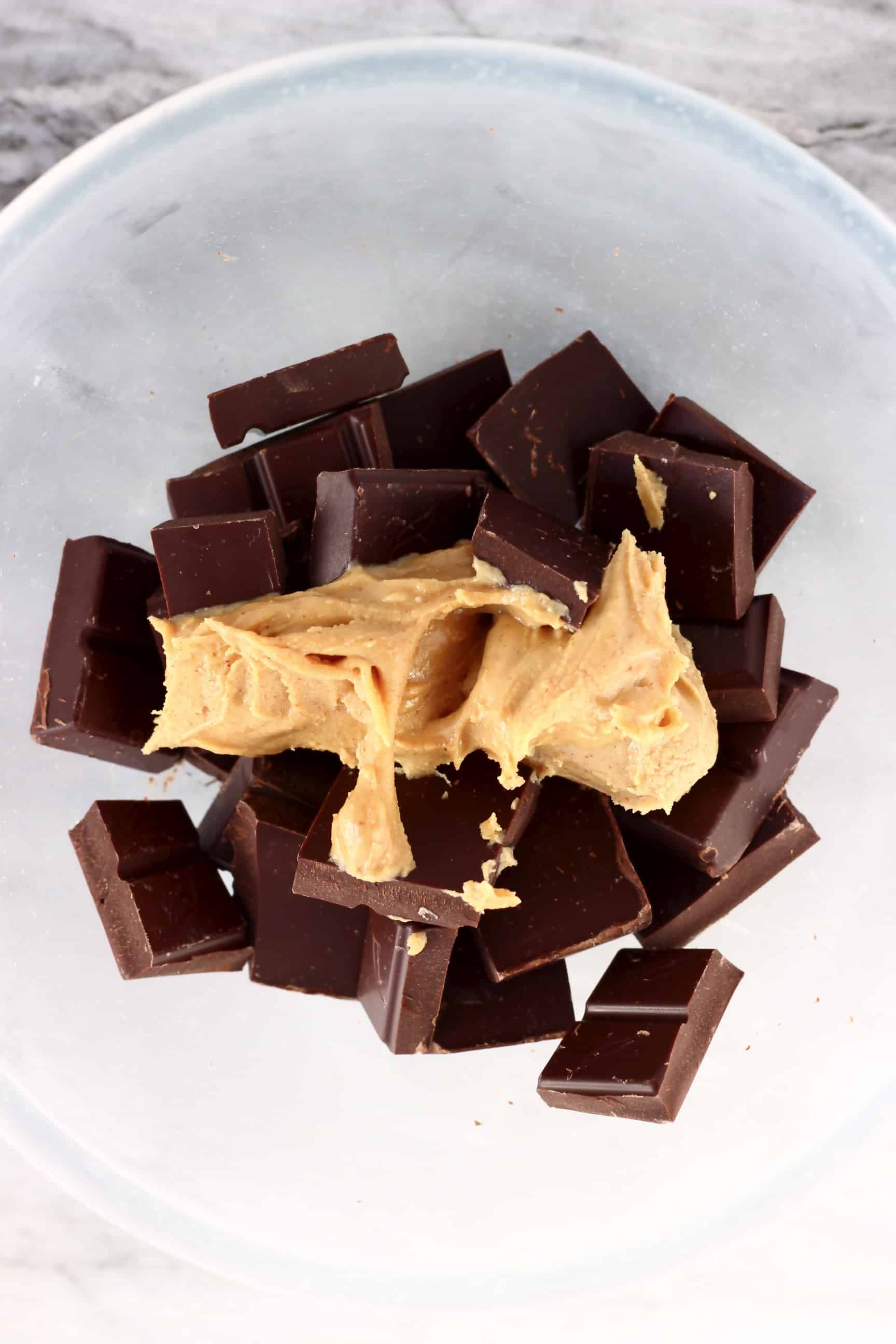 Dark chocolate pieces and peanut butter in a bowl