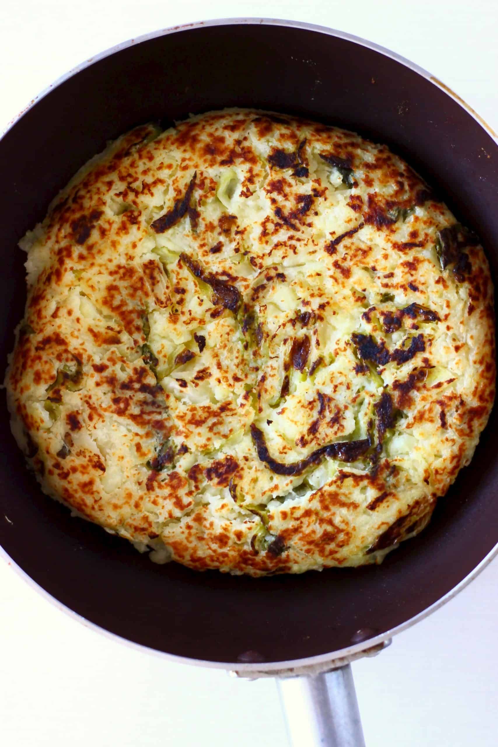 A round bubble and squeak in a brown frying pan