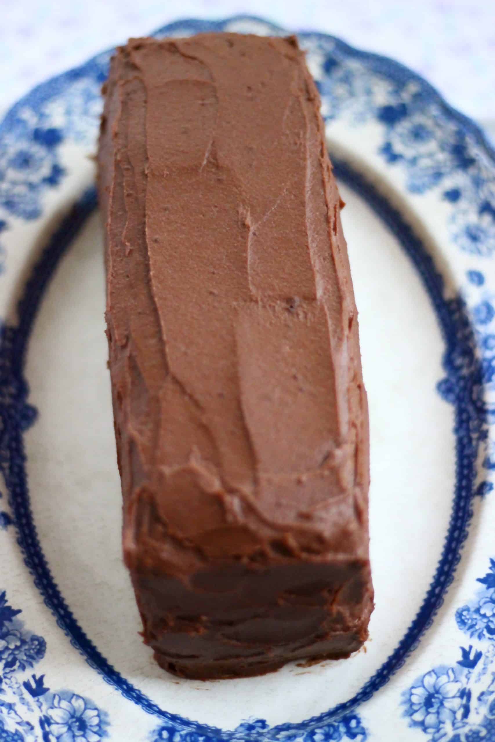 Gluten-free vegan yule log covered in chocolate buttercream