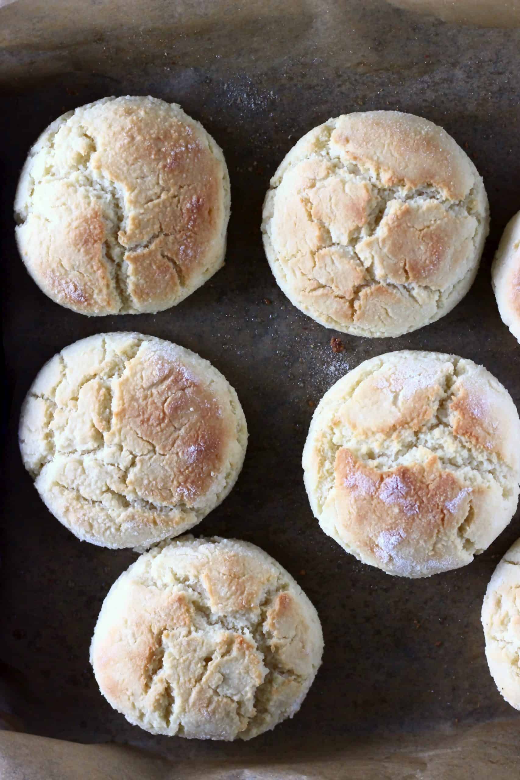 Seven gluten-free vegan biscuits on a baking tray