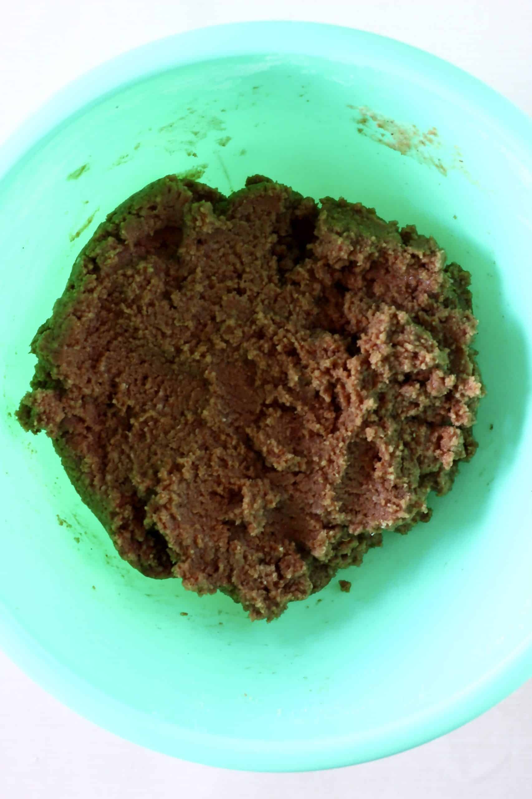 Raw gluten-free vegan gingerbread cookie bars dough in a bowl