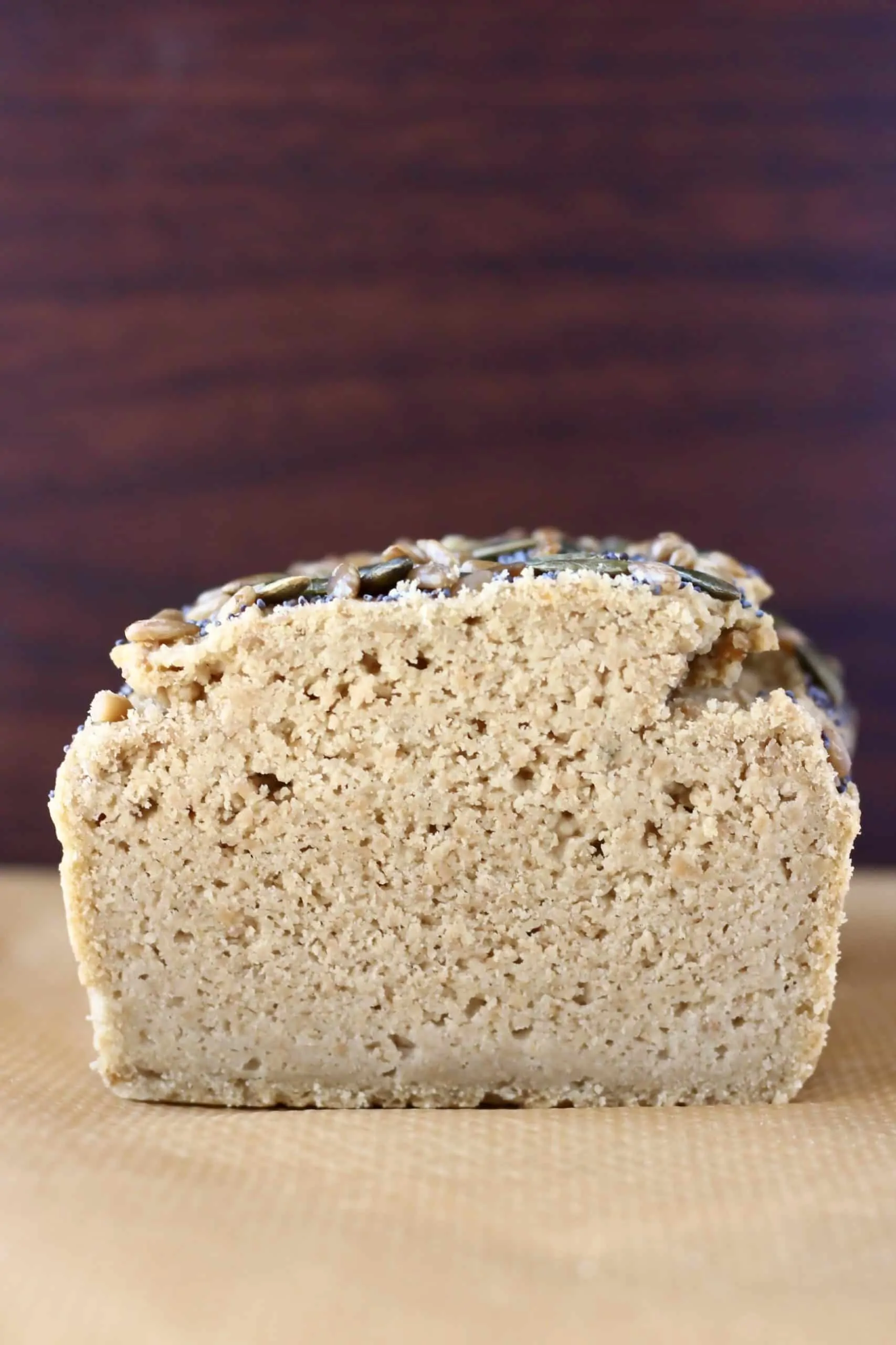 A sliced loaf of sunflower seed bread