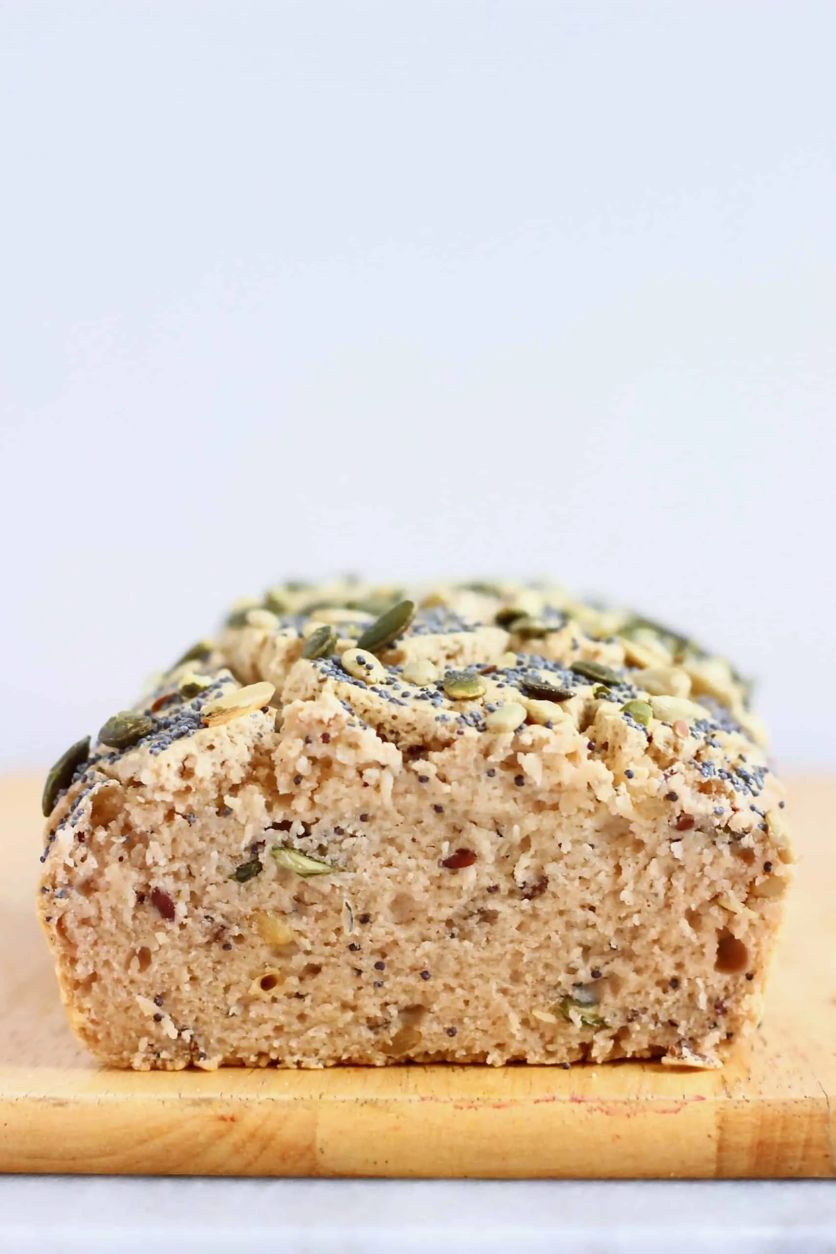 A loaf of buckwheat bread topped with seeds