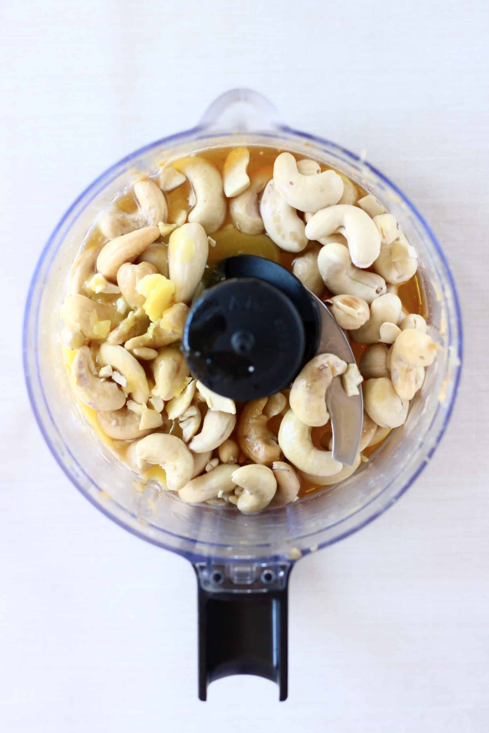 Cashews, maple syrup and cacao butter in a food processor