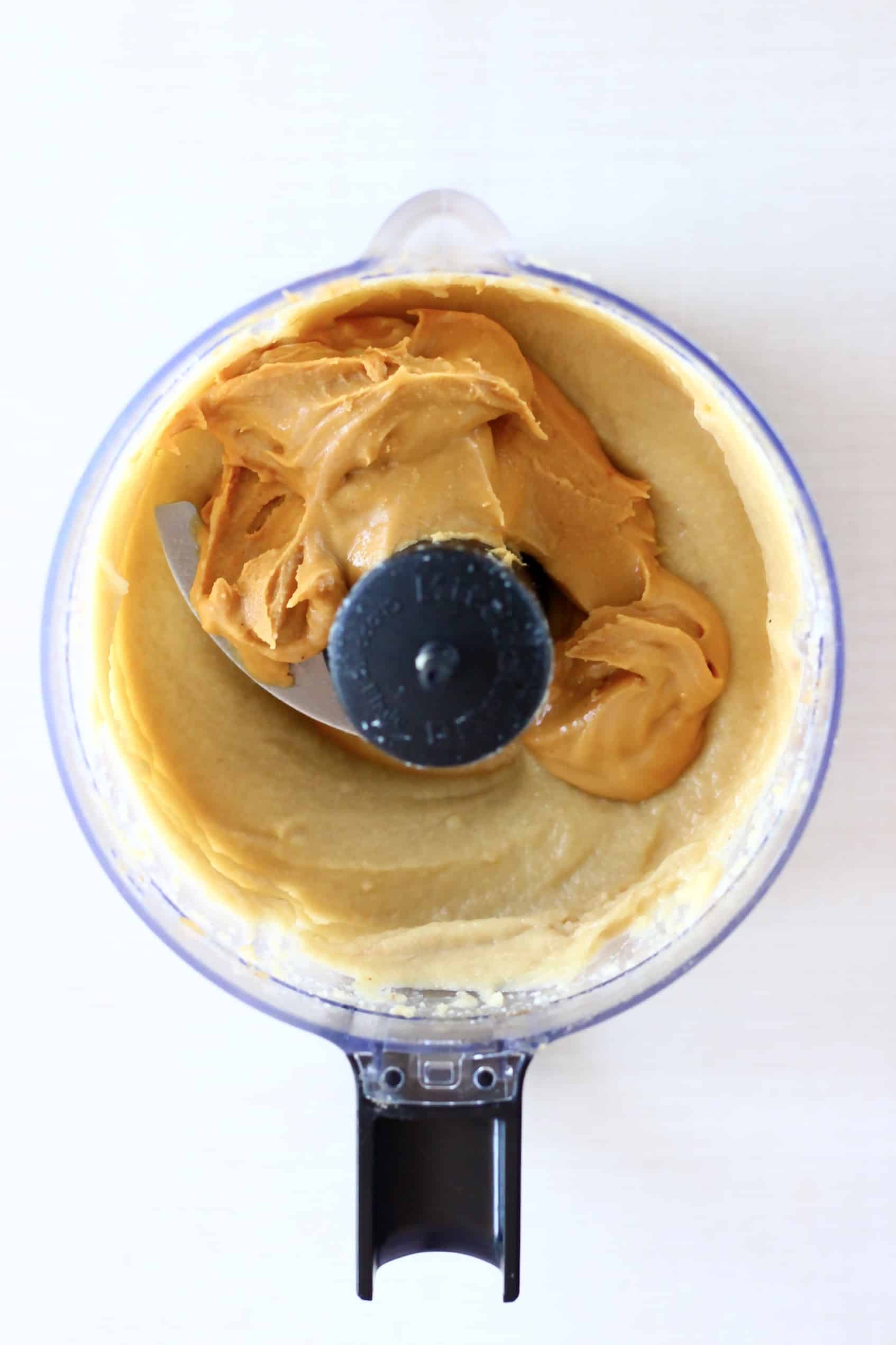 Blended cashew nuts and peanut butter in a food processor