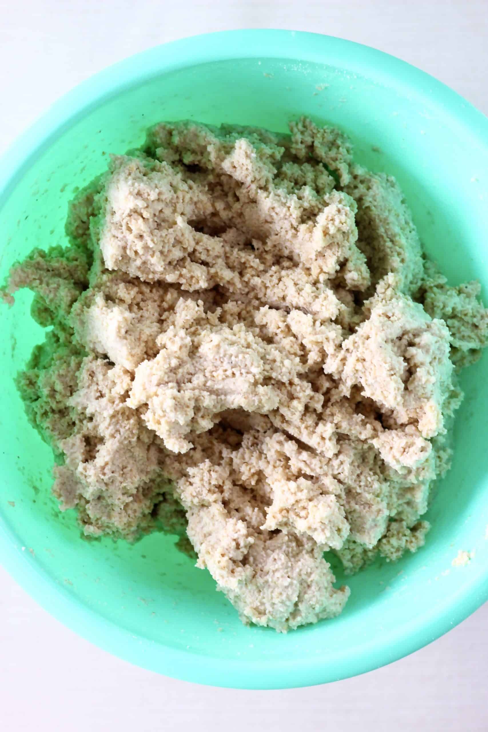 Oat flour bread dough in a mixing bowl