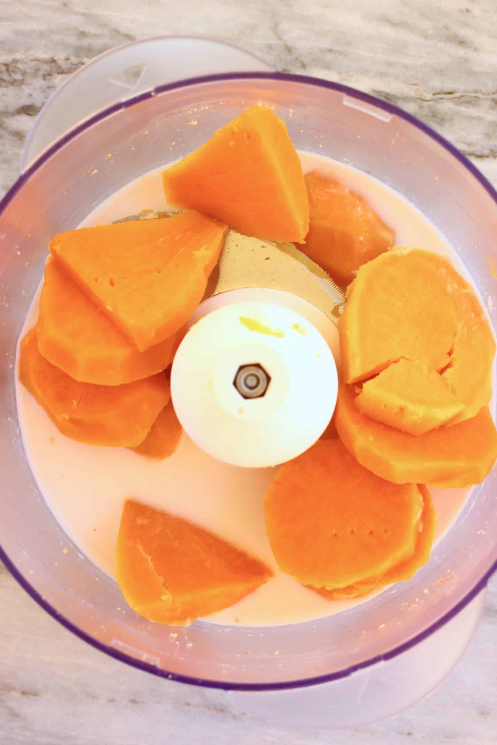 Cooked sweet potato and almond milk in a food processor