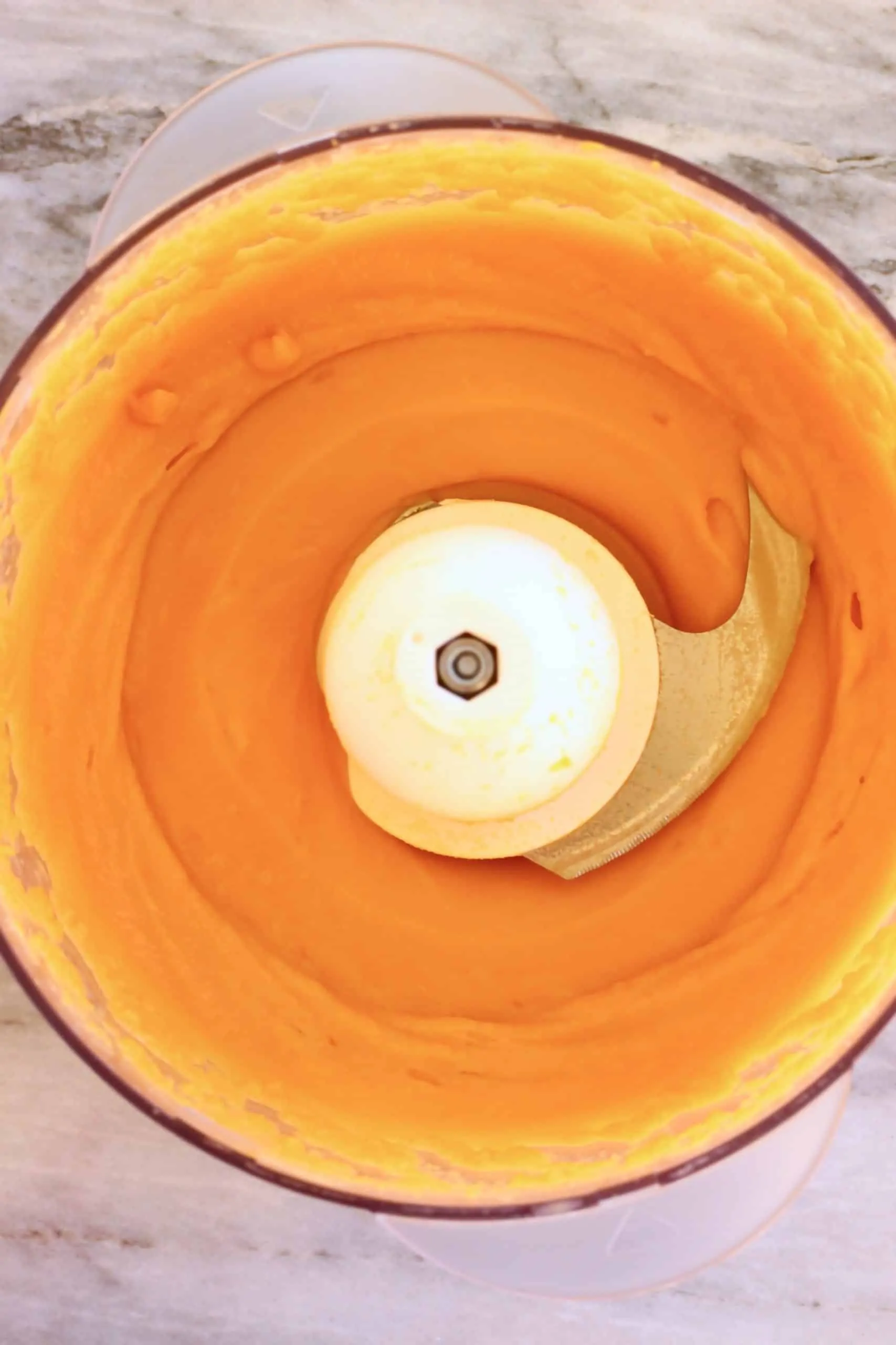 Blended cooked sweet potatoes in a food processor