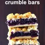 Three blueberry crumble bars stacked on top of each other