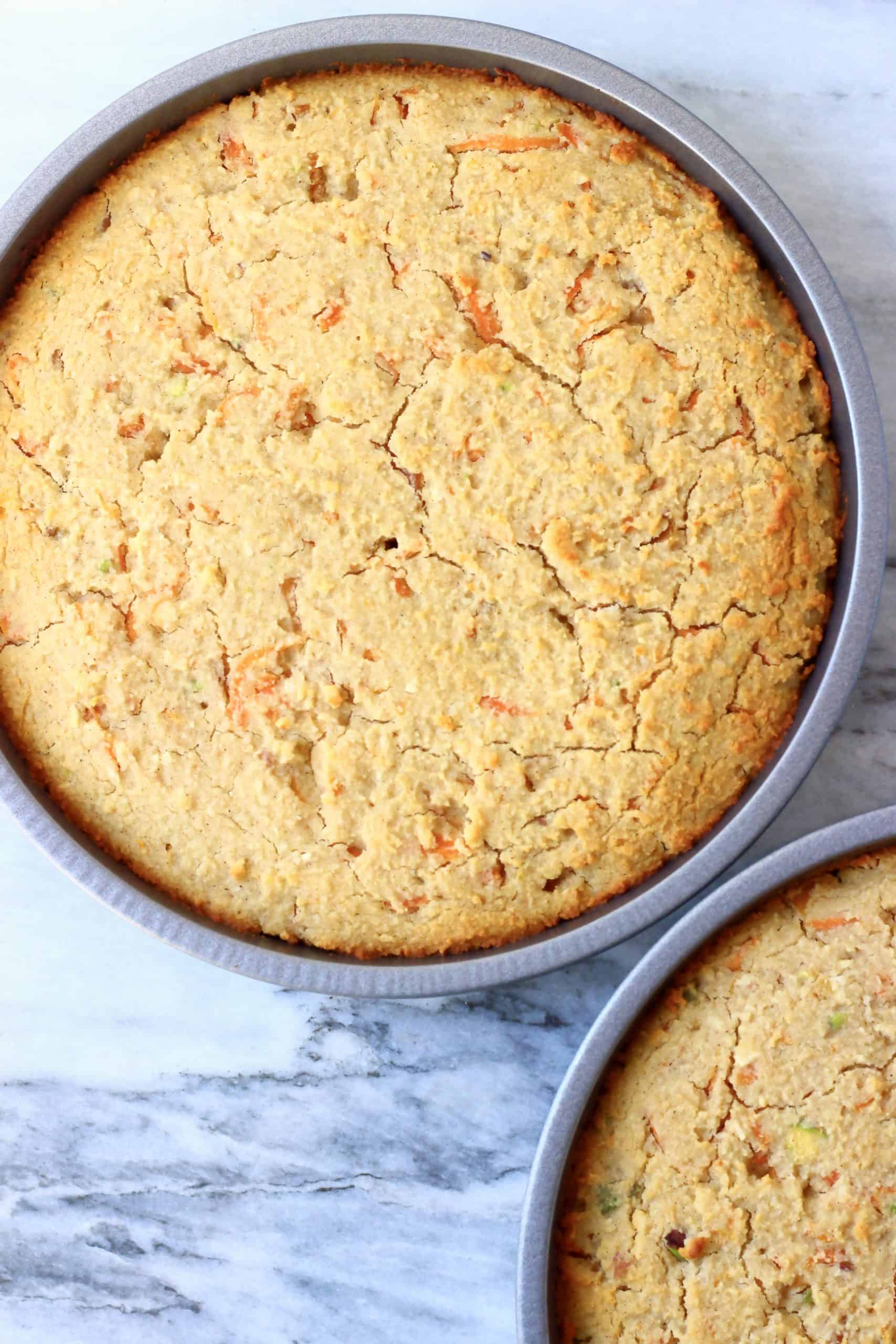 Vegan carrot cake sponges in two baking tins