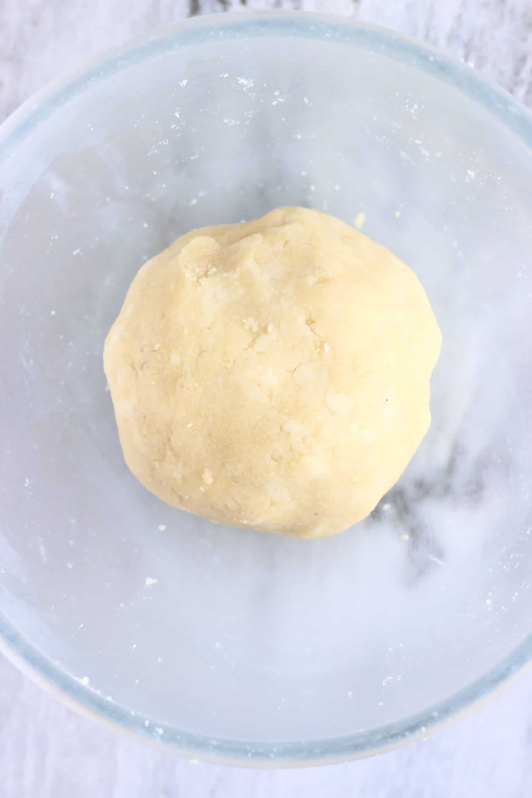 Raw gluten-free vegan pastry dough in a glass bowl