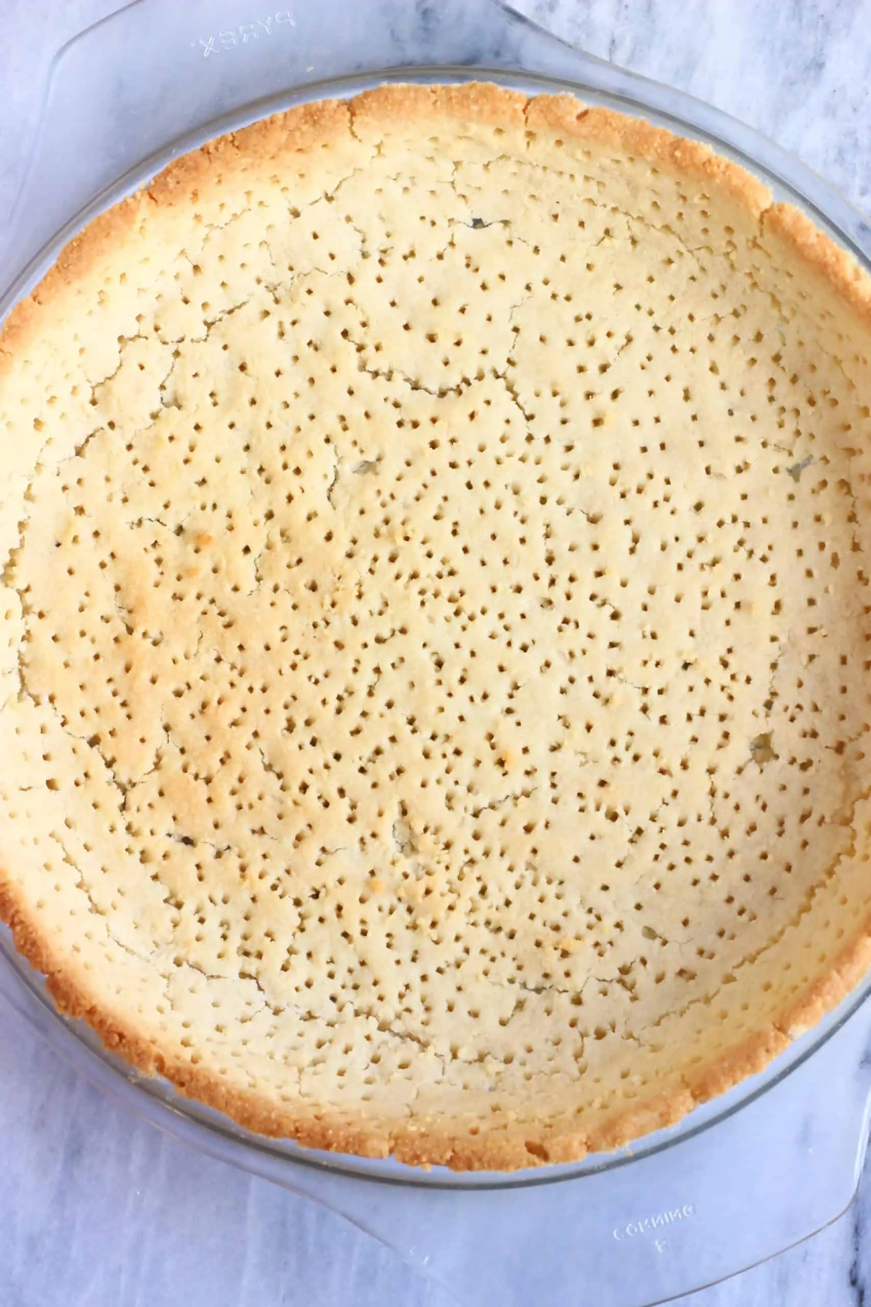 Baked gluten-free vegan tart crust in a pie dish