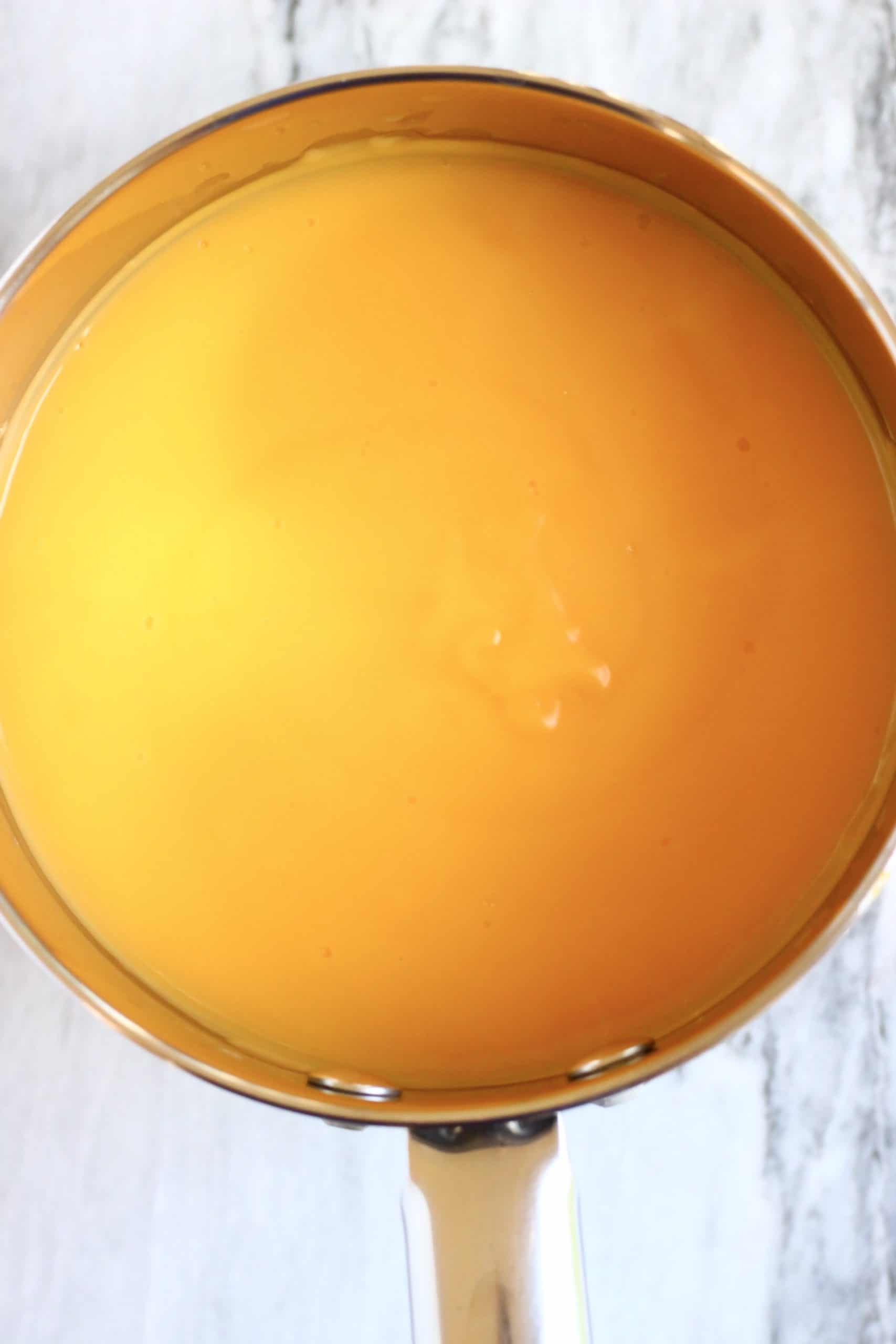 Vegan lemon custard in a saucepan