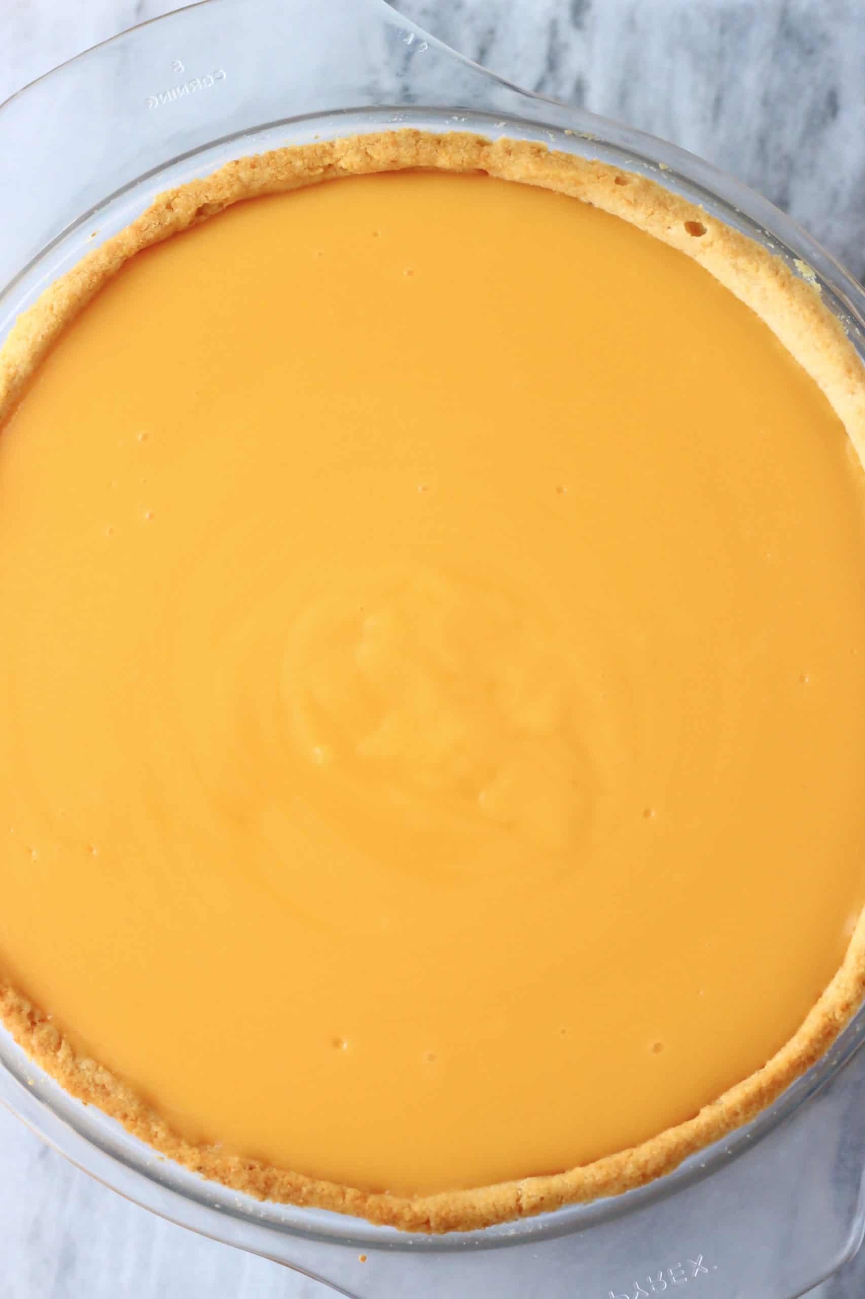 Gluten-free vegan lemon tart in a pie dish