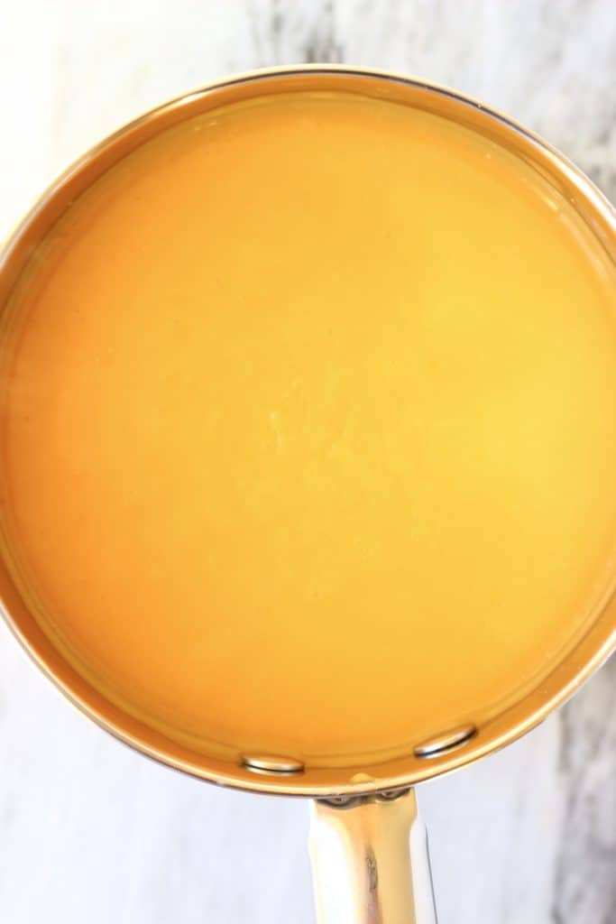 Lemon curd in a silver saucepan