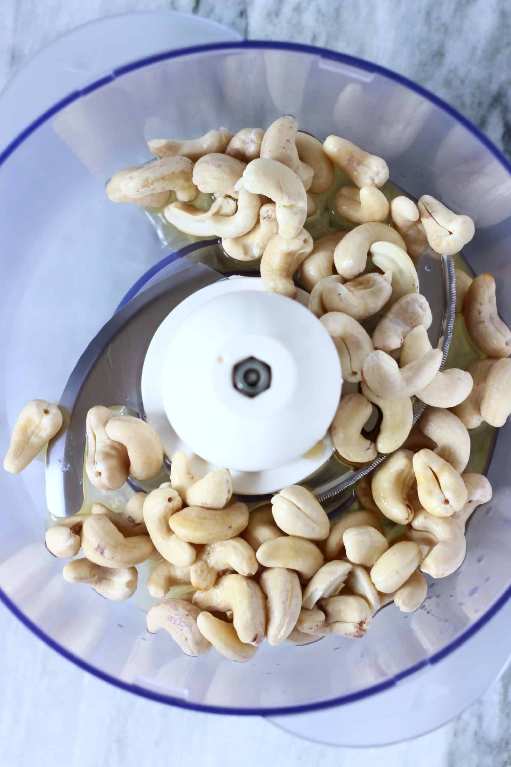 Cashew nuts, cacao butter and maple syrup in a food processor