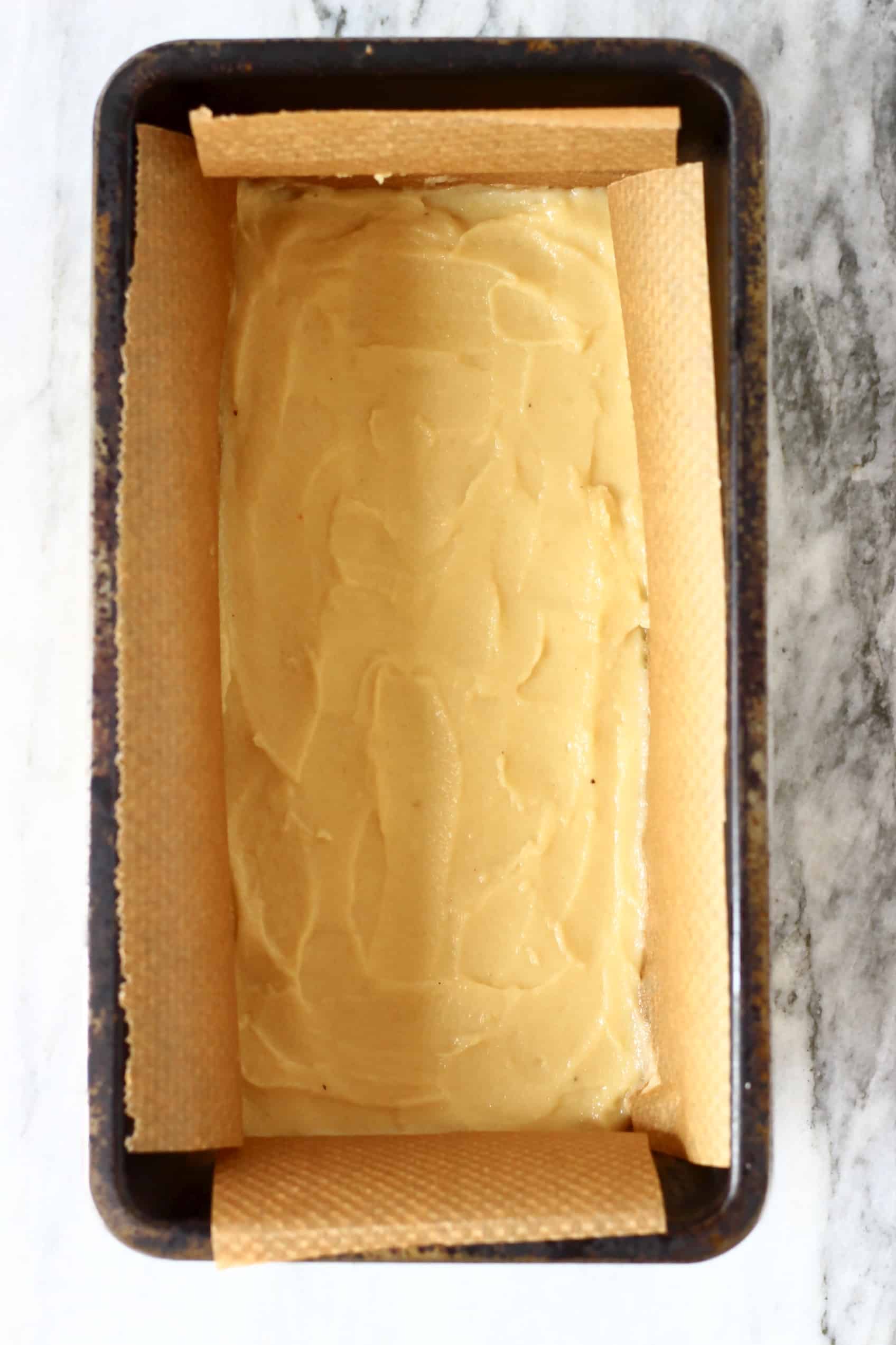 Vegan nougat spread along the bottom of a loaf tin