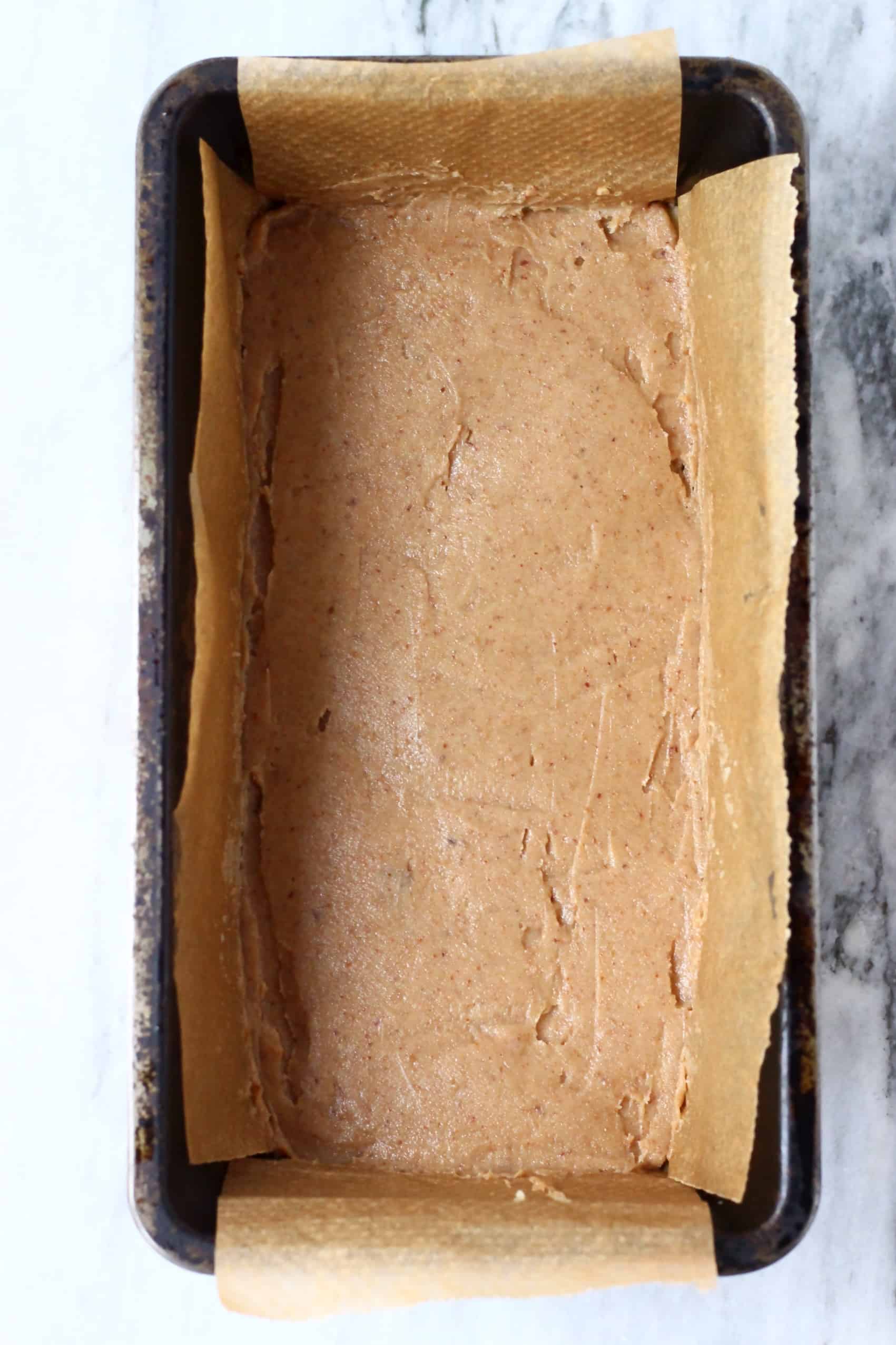 Caramel spread over nougat in a loaf tin