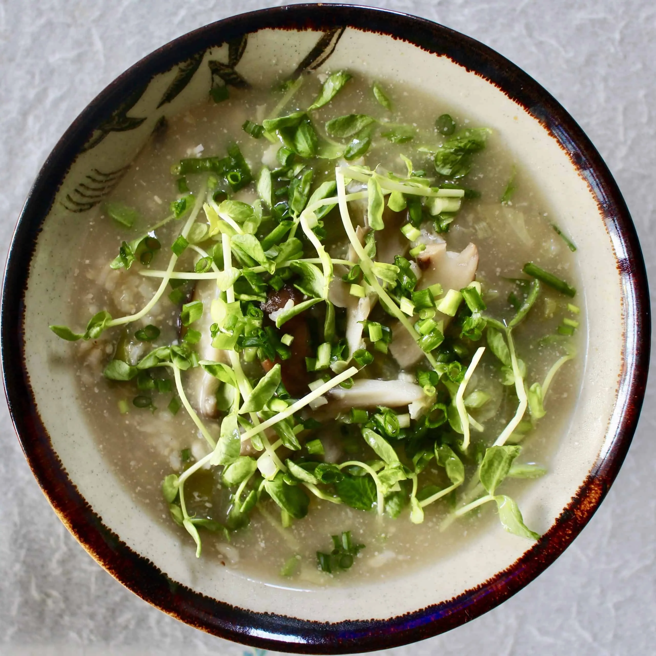 Miso brown rice soup in a brown bowl