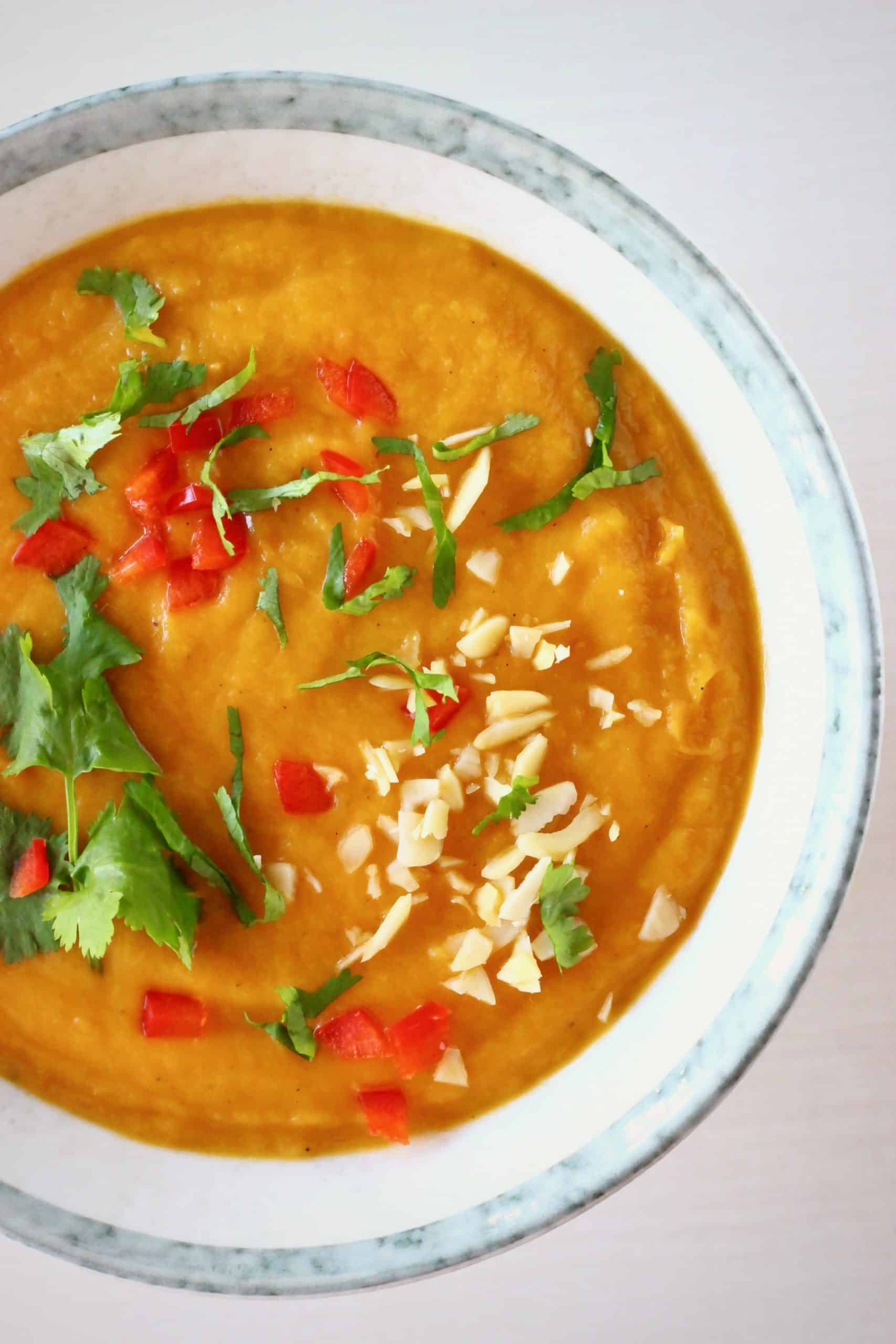 Sweet potato peanut soup in a white bowl