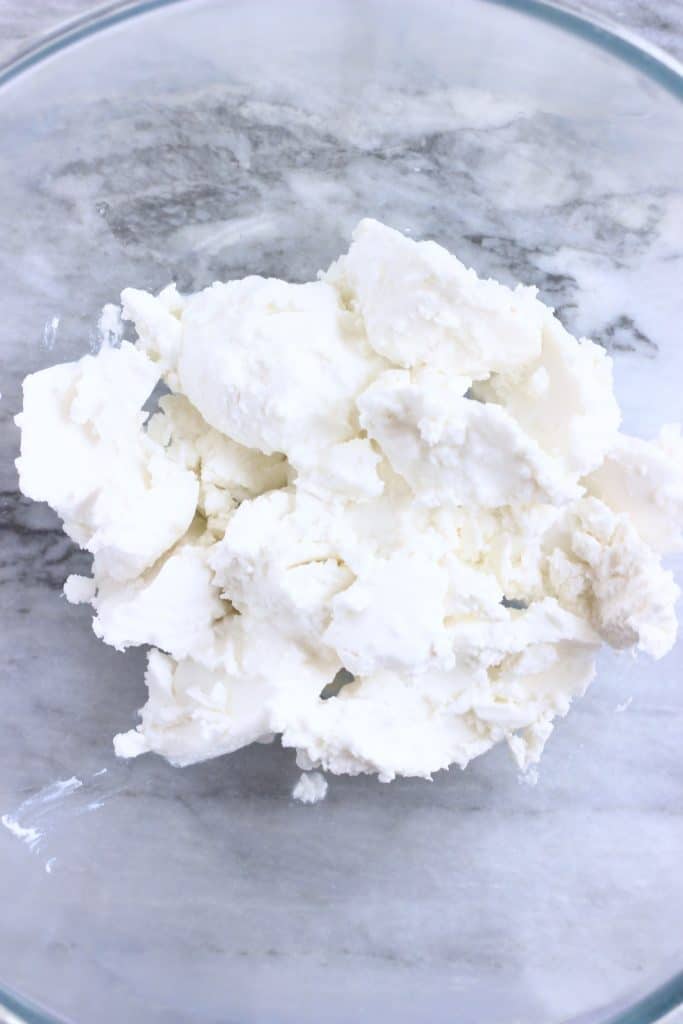 Hard coconut milk in a glass mixing bowl