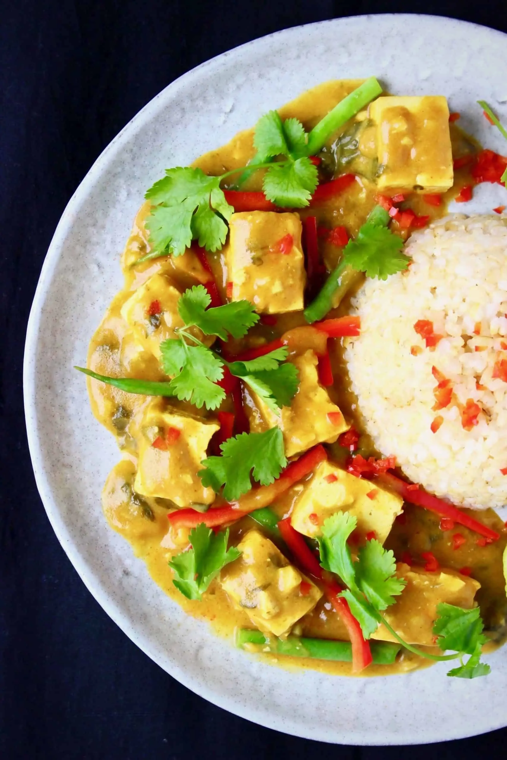 Tofu satay curry with rice on a plate