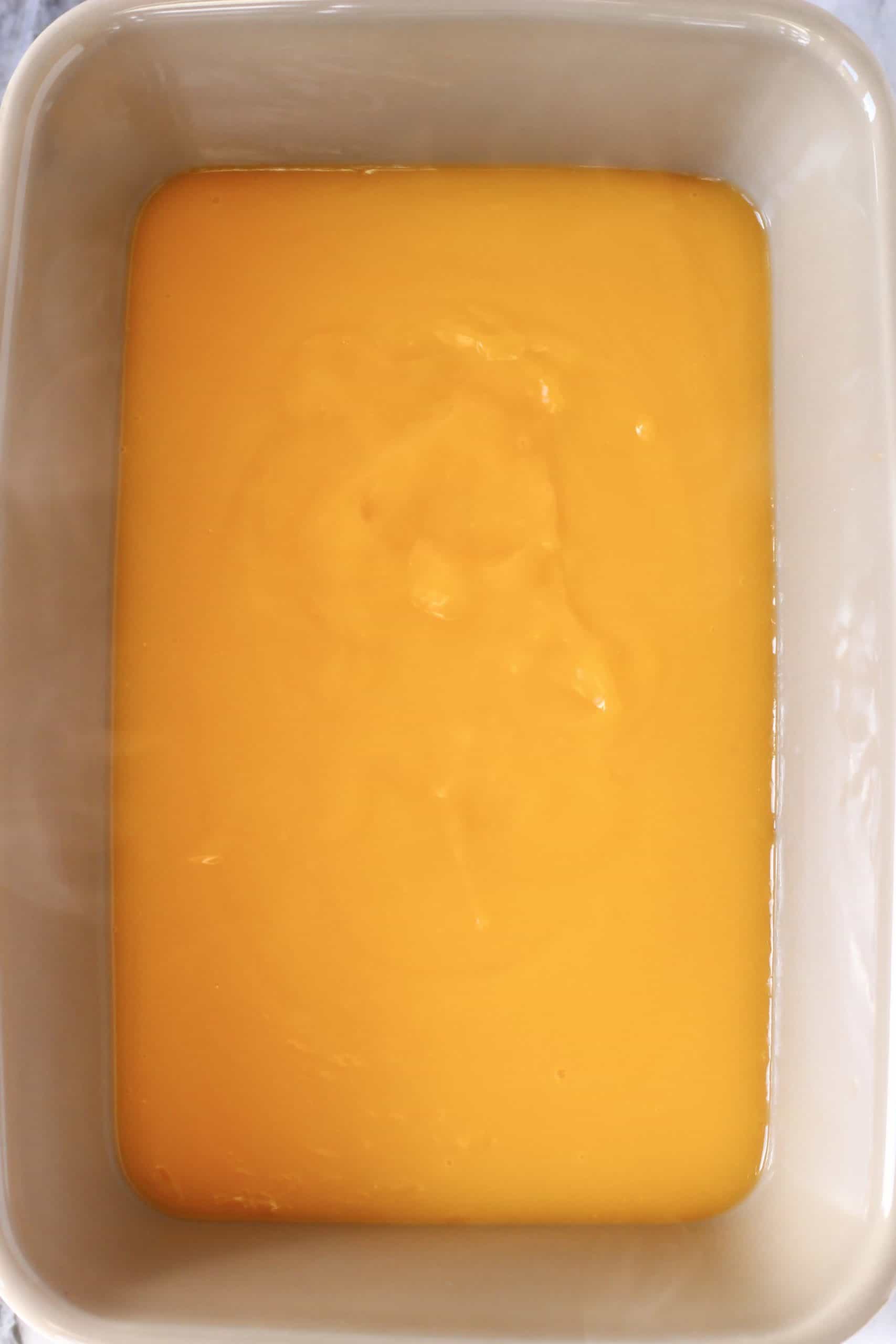 Lemon sauce in a rectangular grey pudding dish