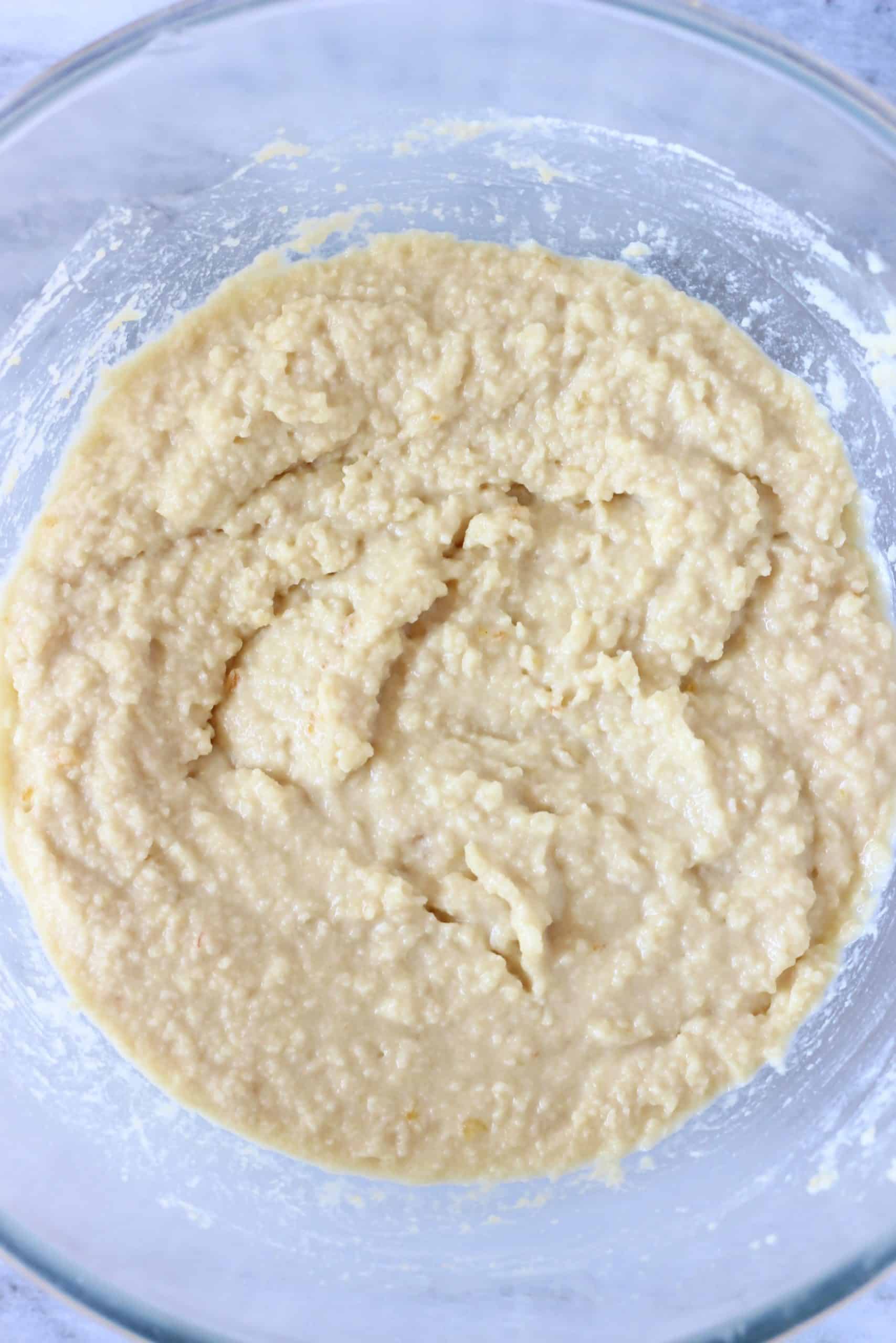 Raw gluten-free vegan orange muffin batter in a glass bowl