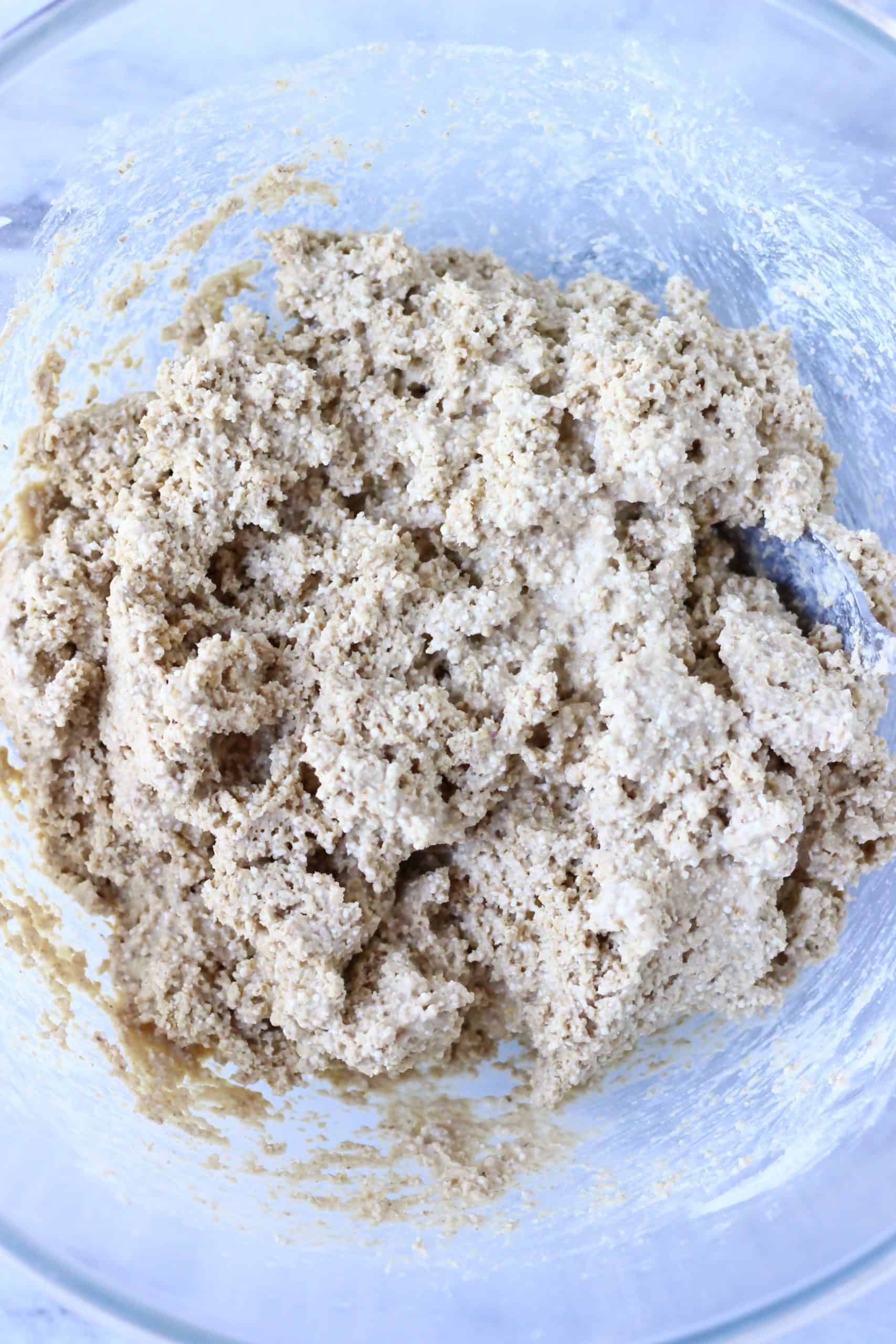 Quinoa bread batter in a glass bowl