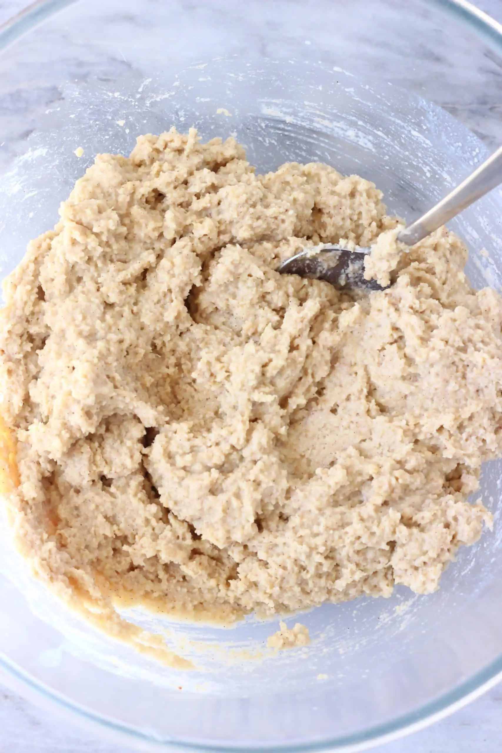 Raw gluten-free vegan peanut butter banana bread batter in a bowl