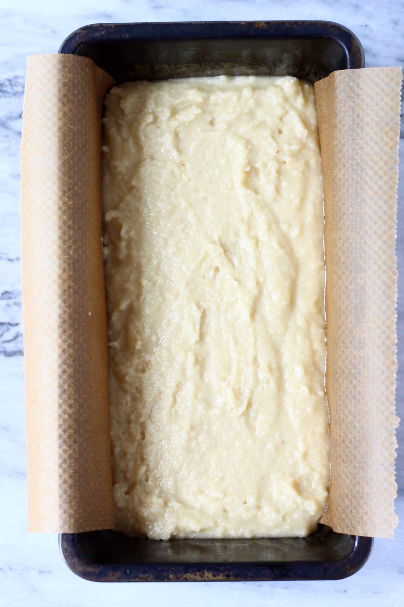 Raw gluten-free vegan lemon bread batter in a loaf tin