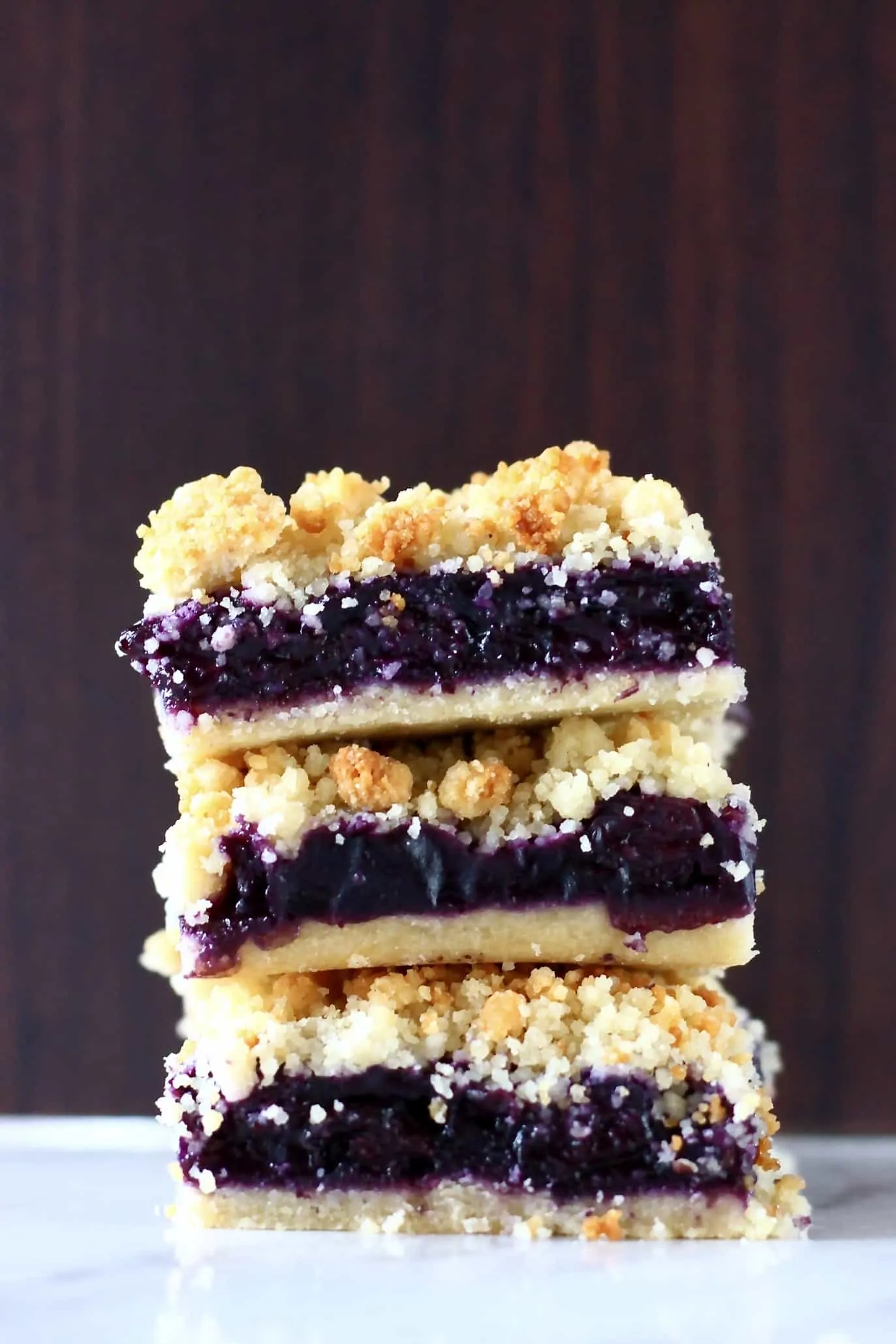 A stack of three gluten-free vegan blueberry crumble bars