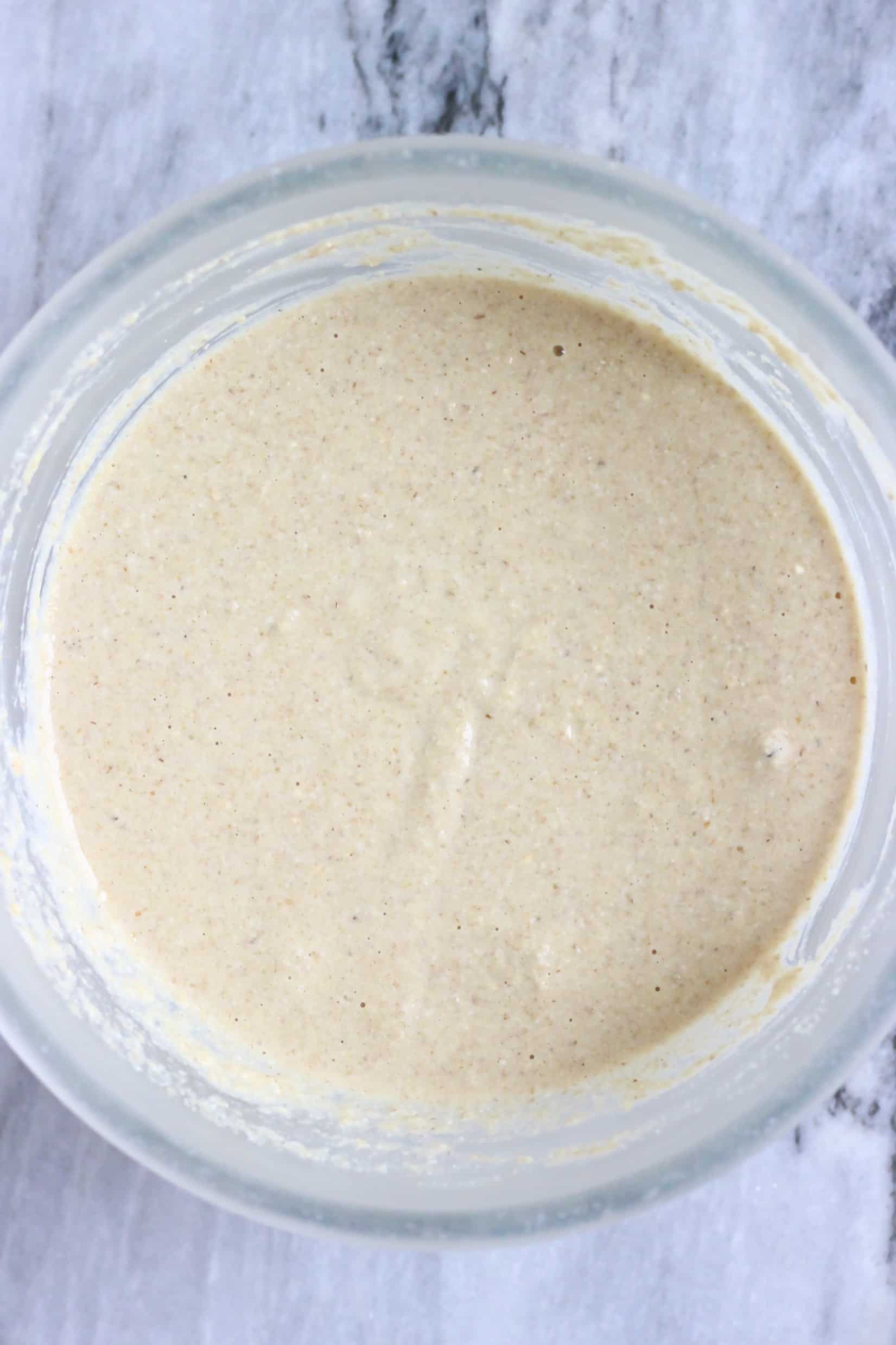 Quinoa pancake batter in a glass bowl