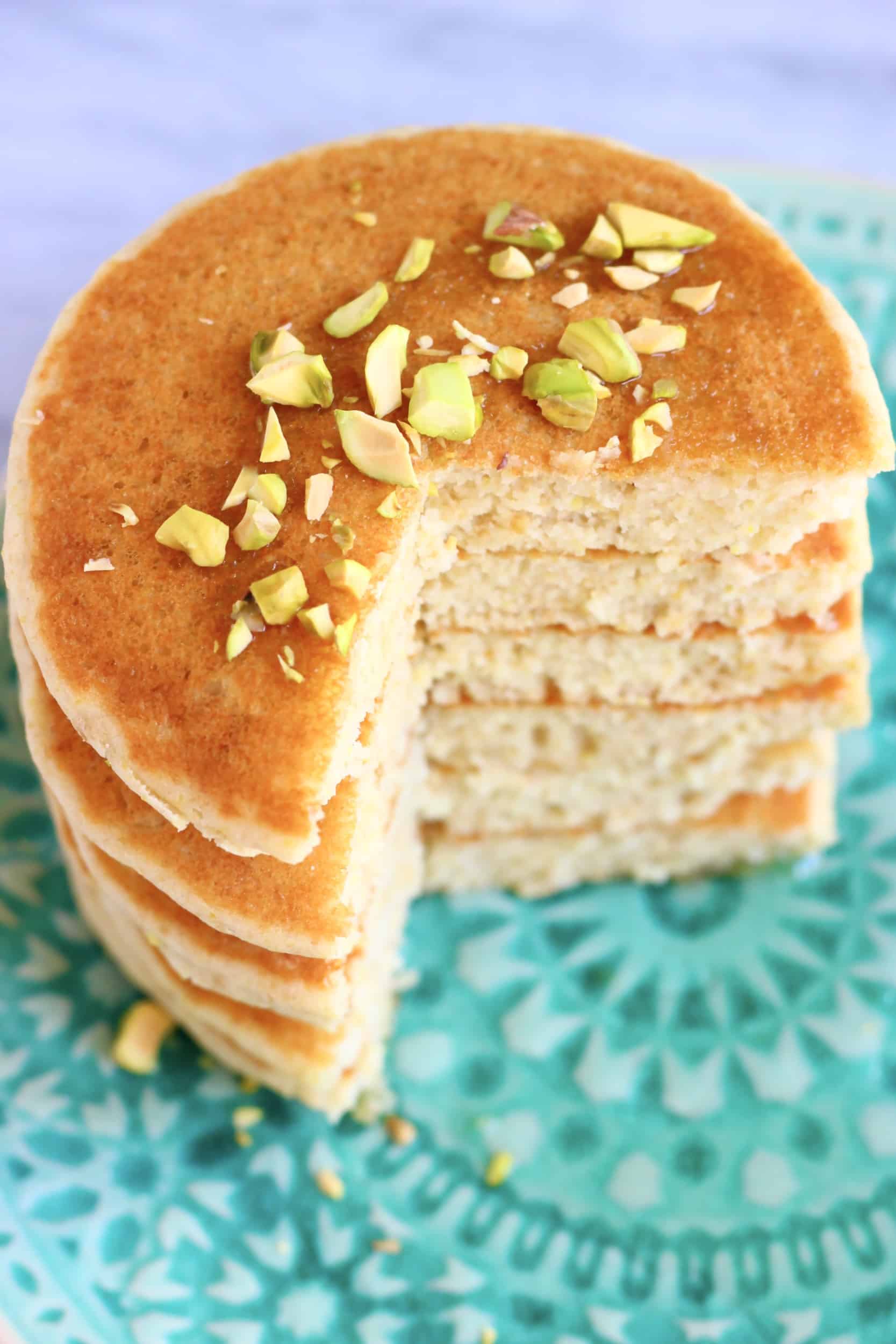 A stack of six sliced flaxseed pancakes on a plate