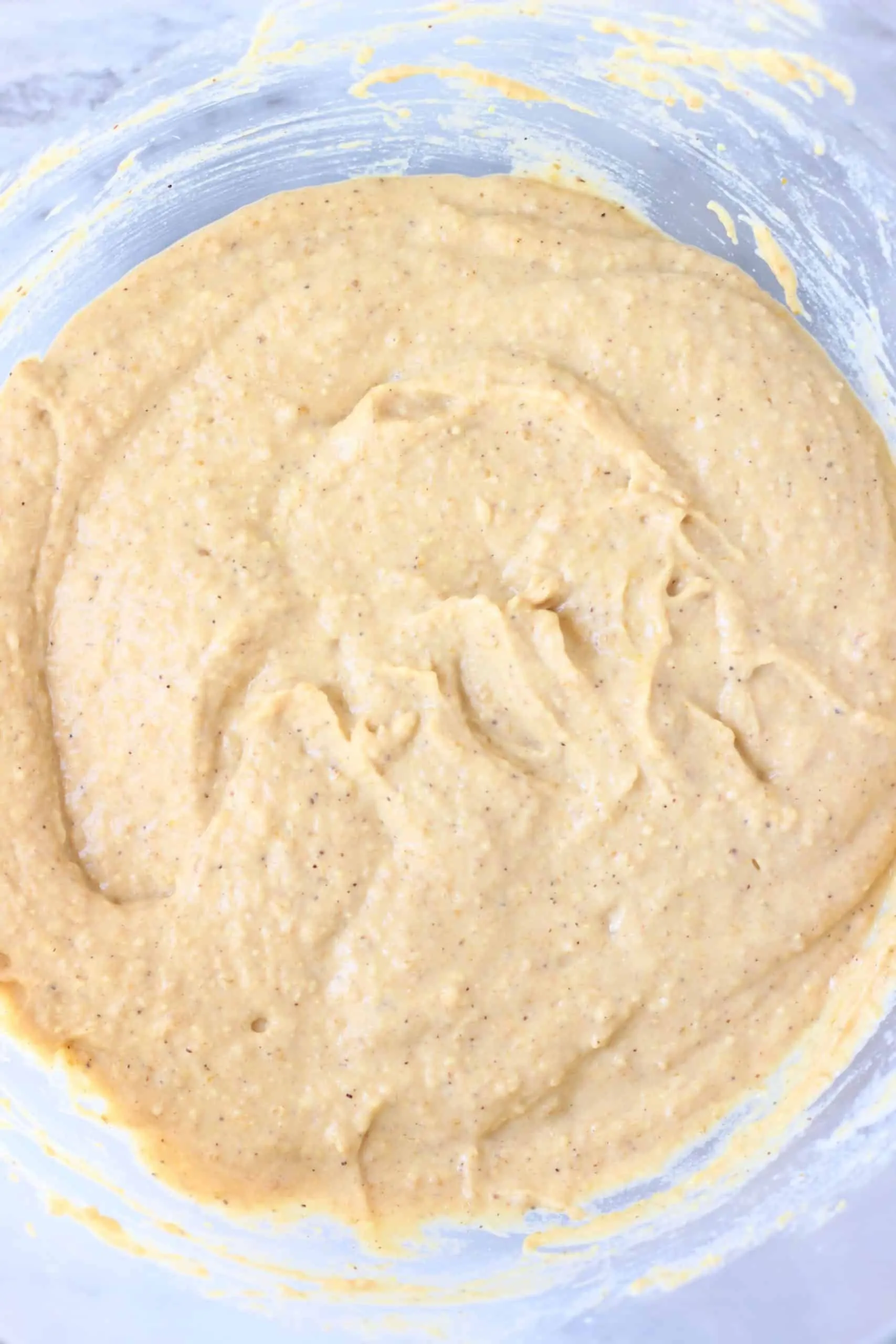 Raw gluten-free vegan pumpkin pancake batter in a glass bowl