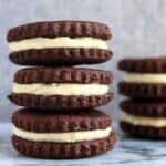 Three gluten-free vegan homemade oreos stacked on top of each other