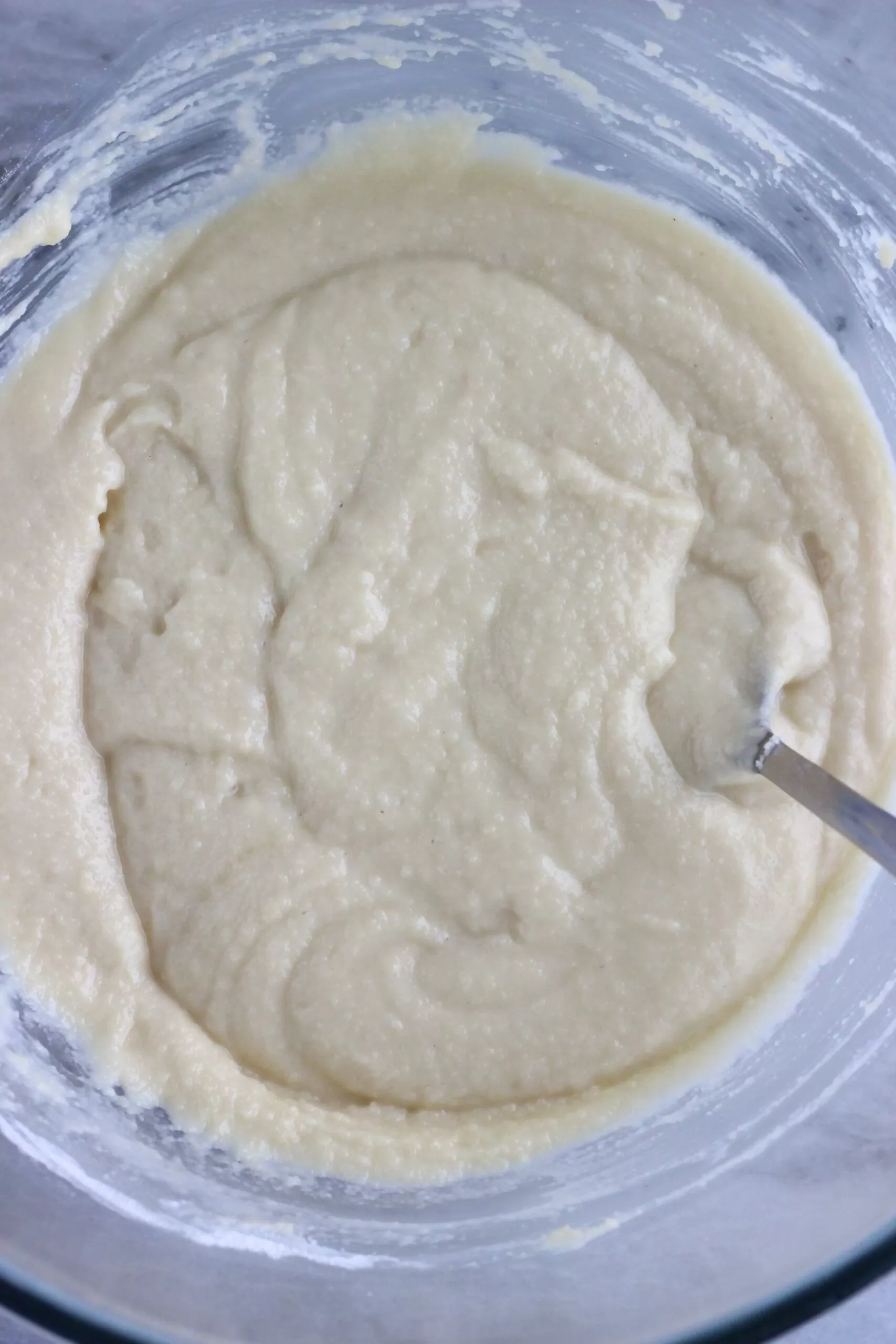 Raw gluten-free vegan almond cake batter in a glass bowl