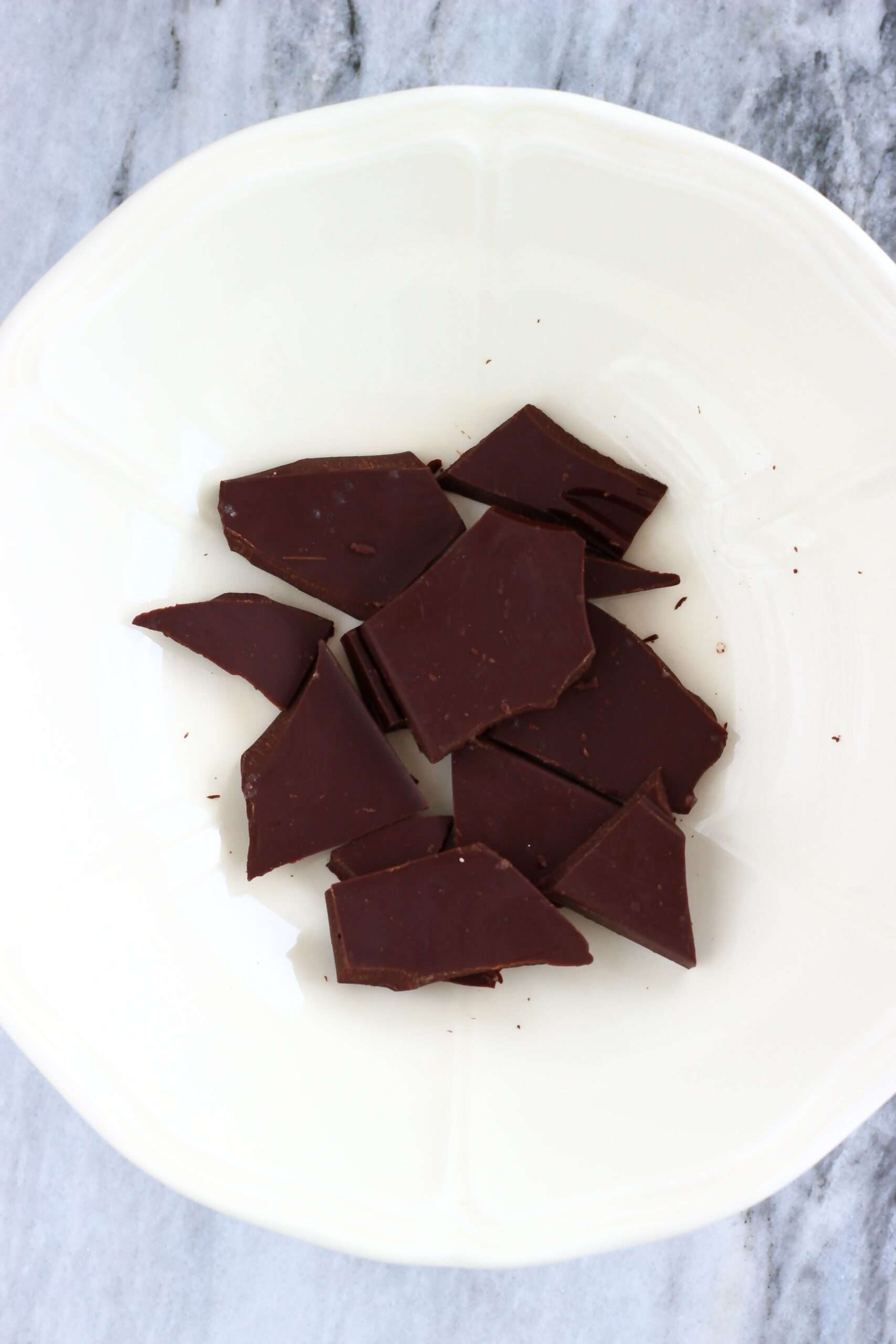 Pieces of dark chocolate in a bowl