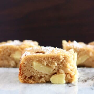 Three square pieces of gluten-free vegan apple snack cake