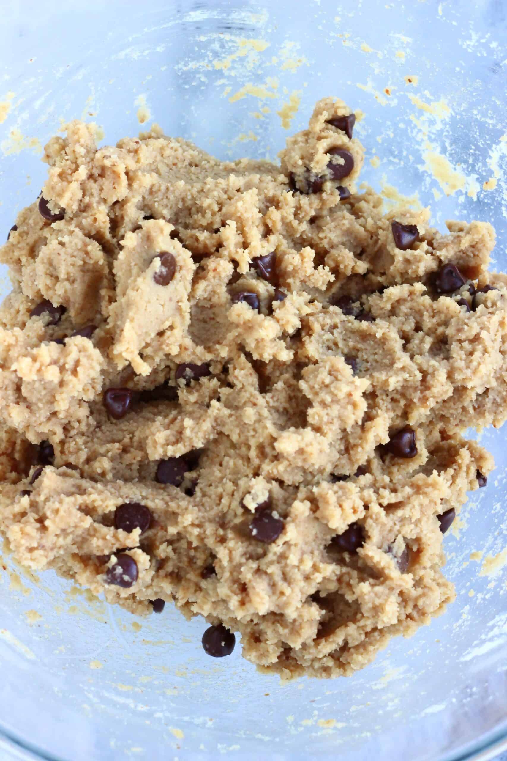 Vegan gluten-free blondies batter with chocolate chips in a mixing bowl