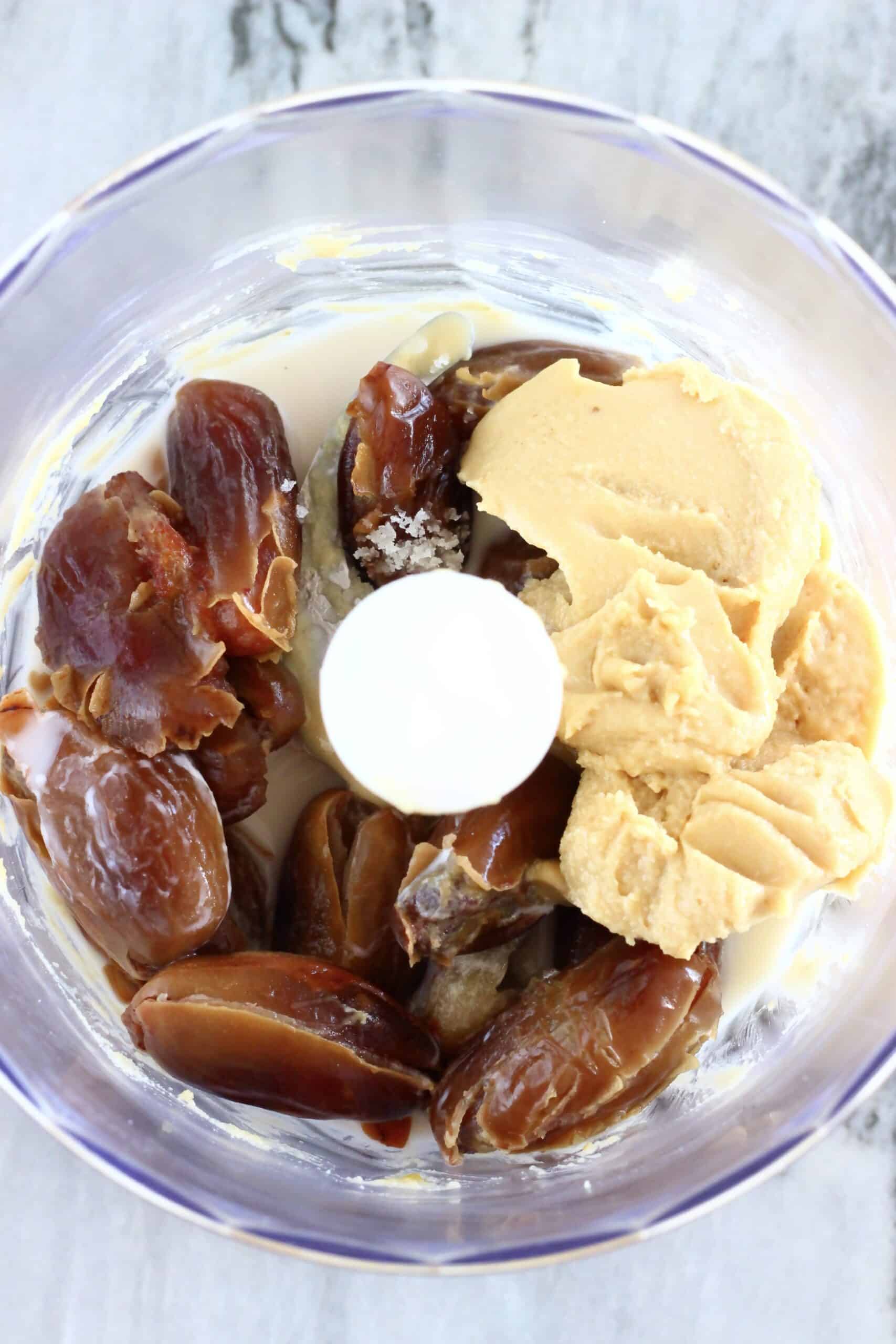 Dates, almond butter and almond milk in a food processor