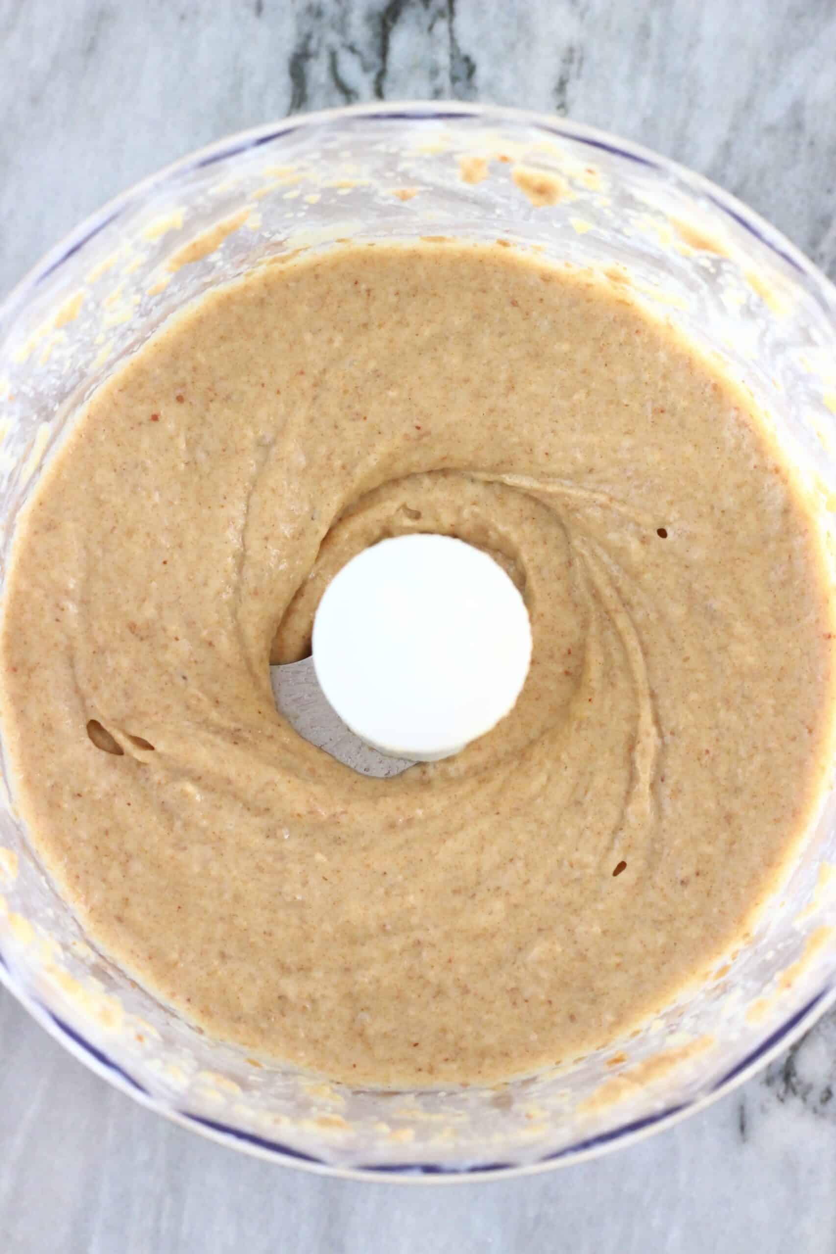 Blended up dates, almond butter and almond milk in a food processor