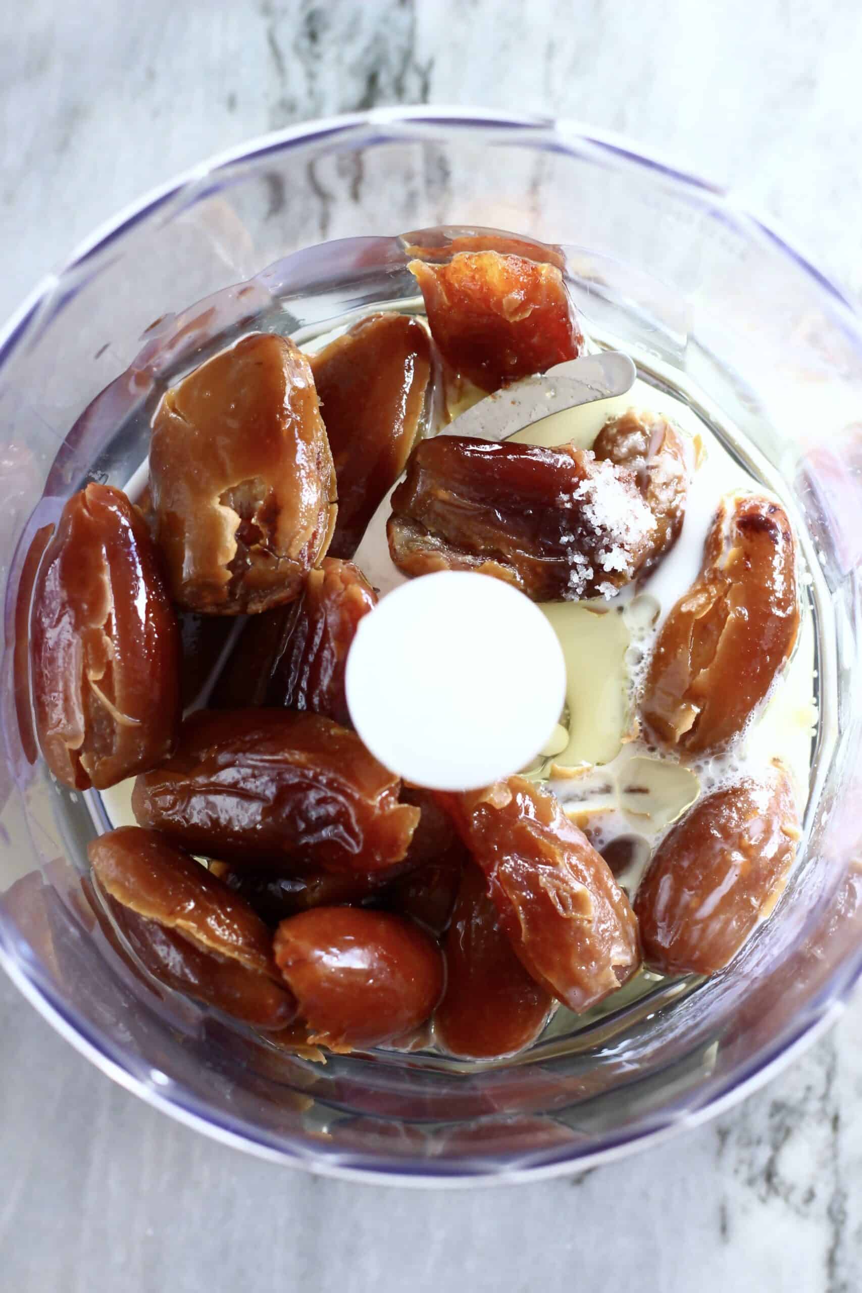 Dates, coconut oil, salt and almond milk in a food processor