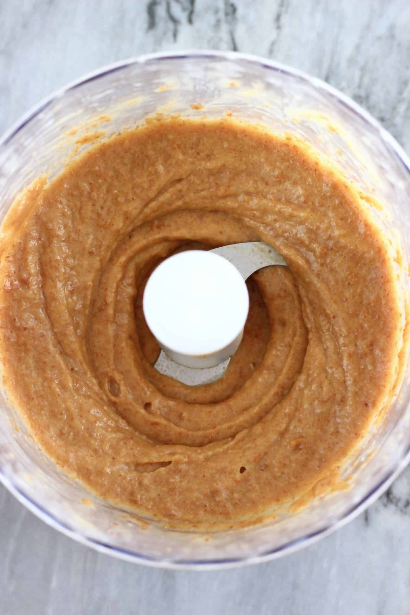 Blended dates and coconut oil in a food processor