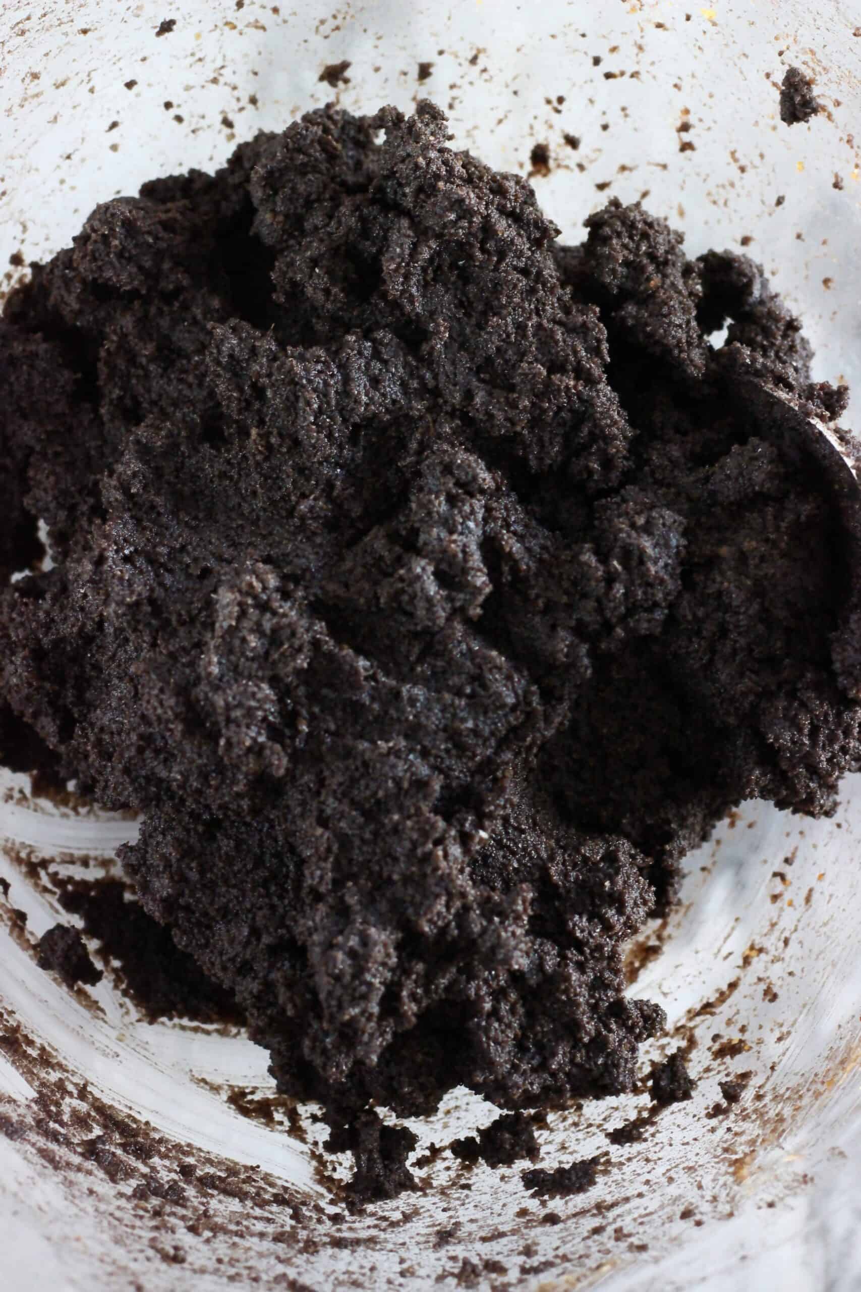 Raw gluten-free vegan chocolate crinkle cookies dough in a mixing bowl