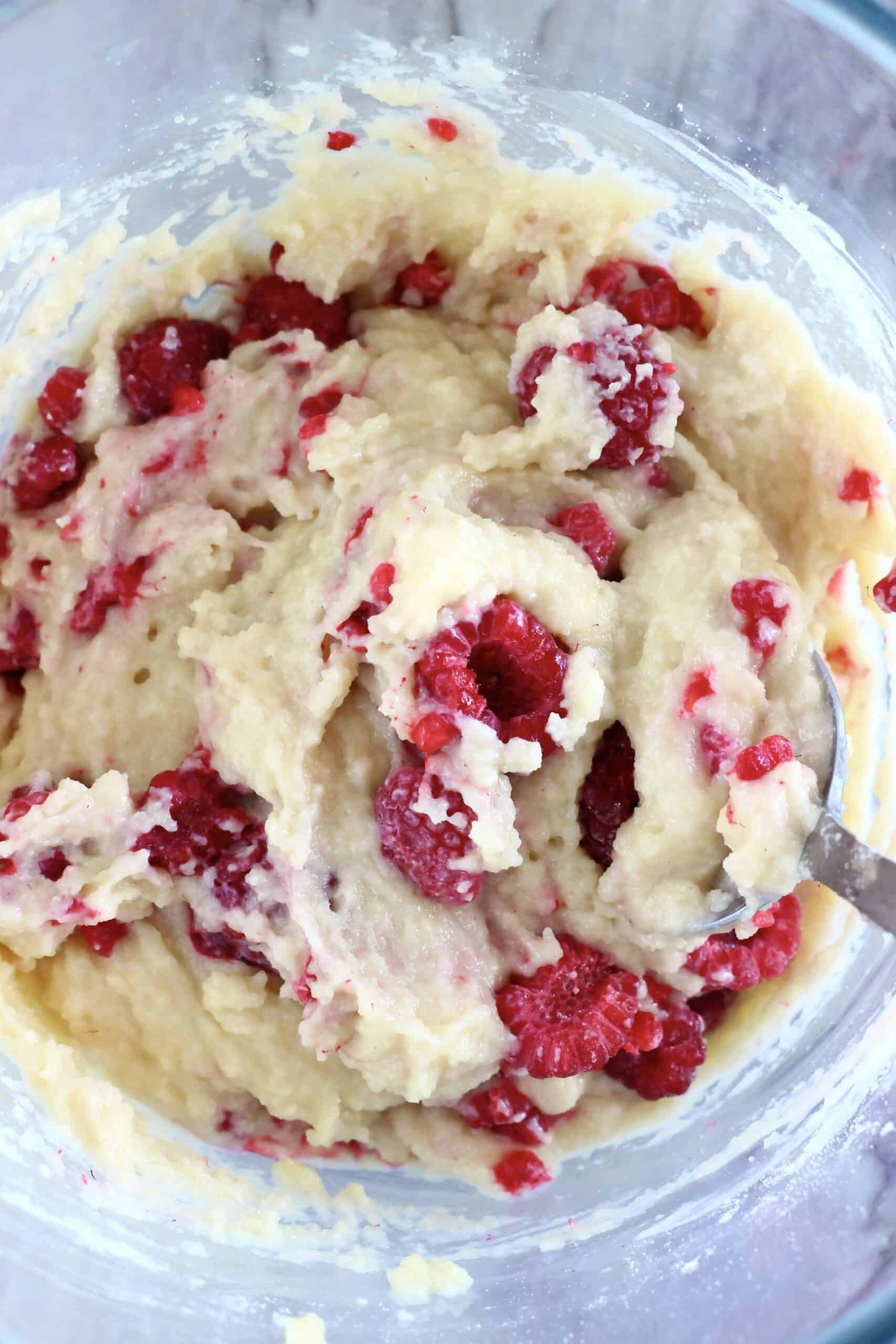 Raw gluten-free vegan raspberry muffins batter in a mixing bowl