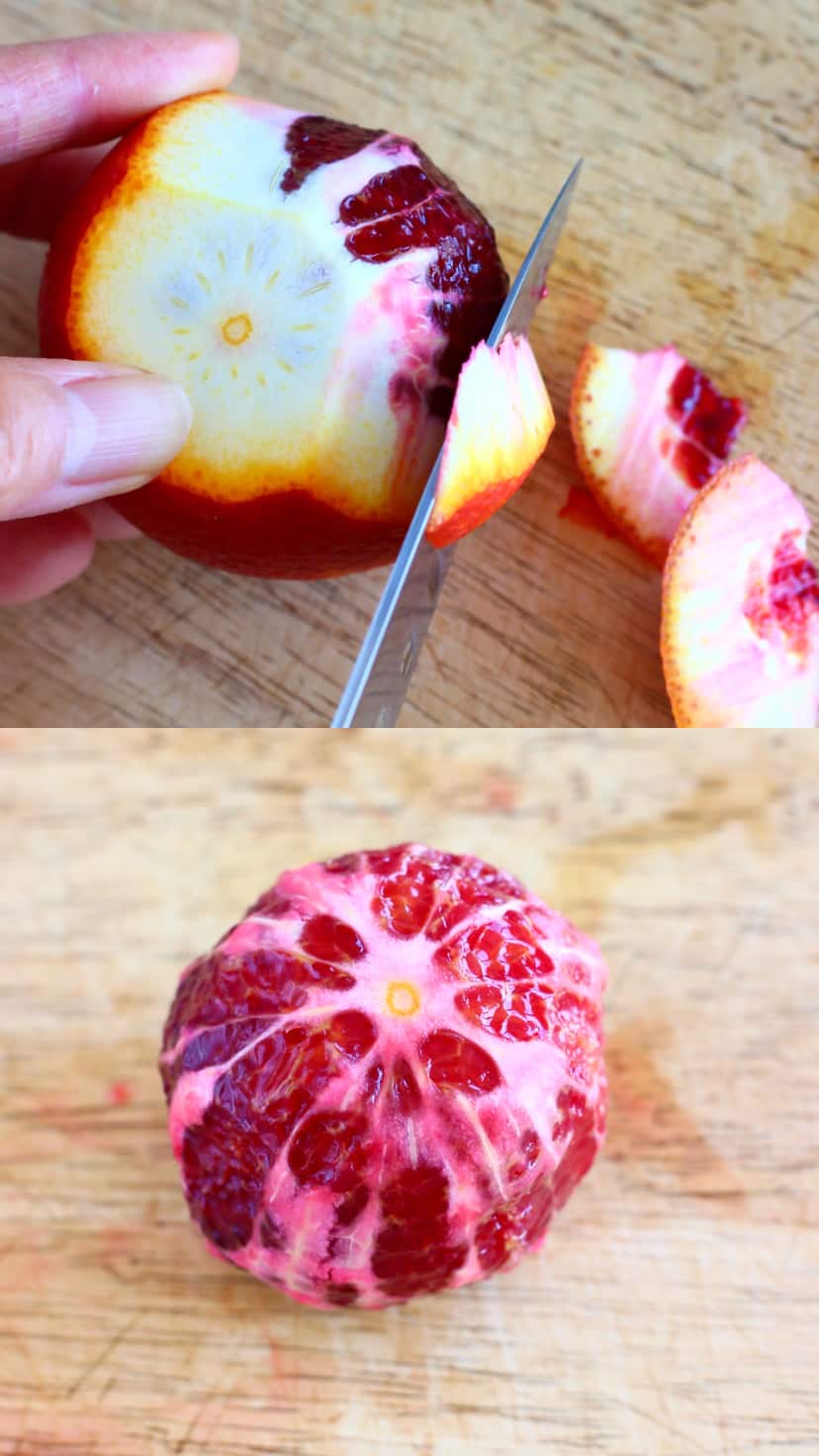 Peeling the skin off a blood orange using a knife, and a peeled blood orange