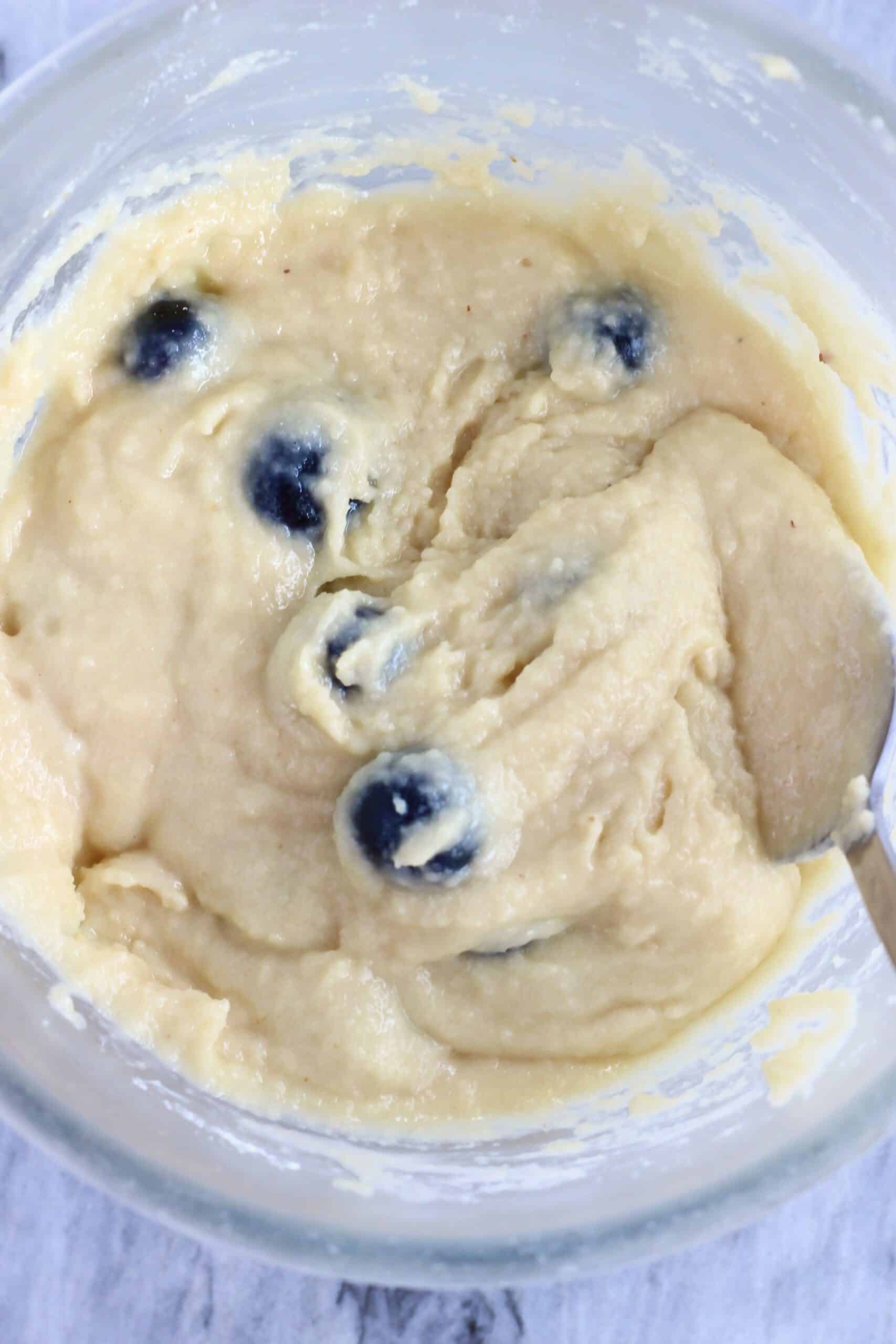 Raw gluten-free vegan lemon blueberry muffin batter in a mixing bowl